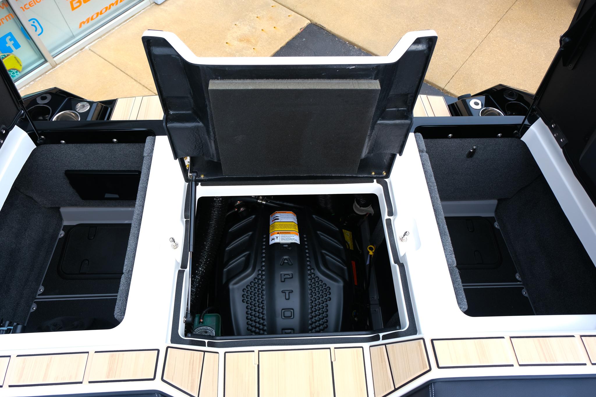 2025 Supra SE450 engine compartment with open hatch, showcasing modern design and storage spaces.