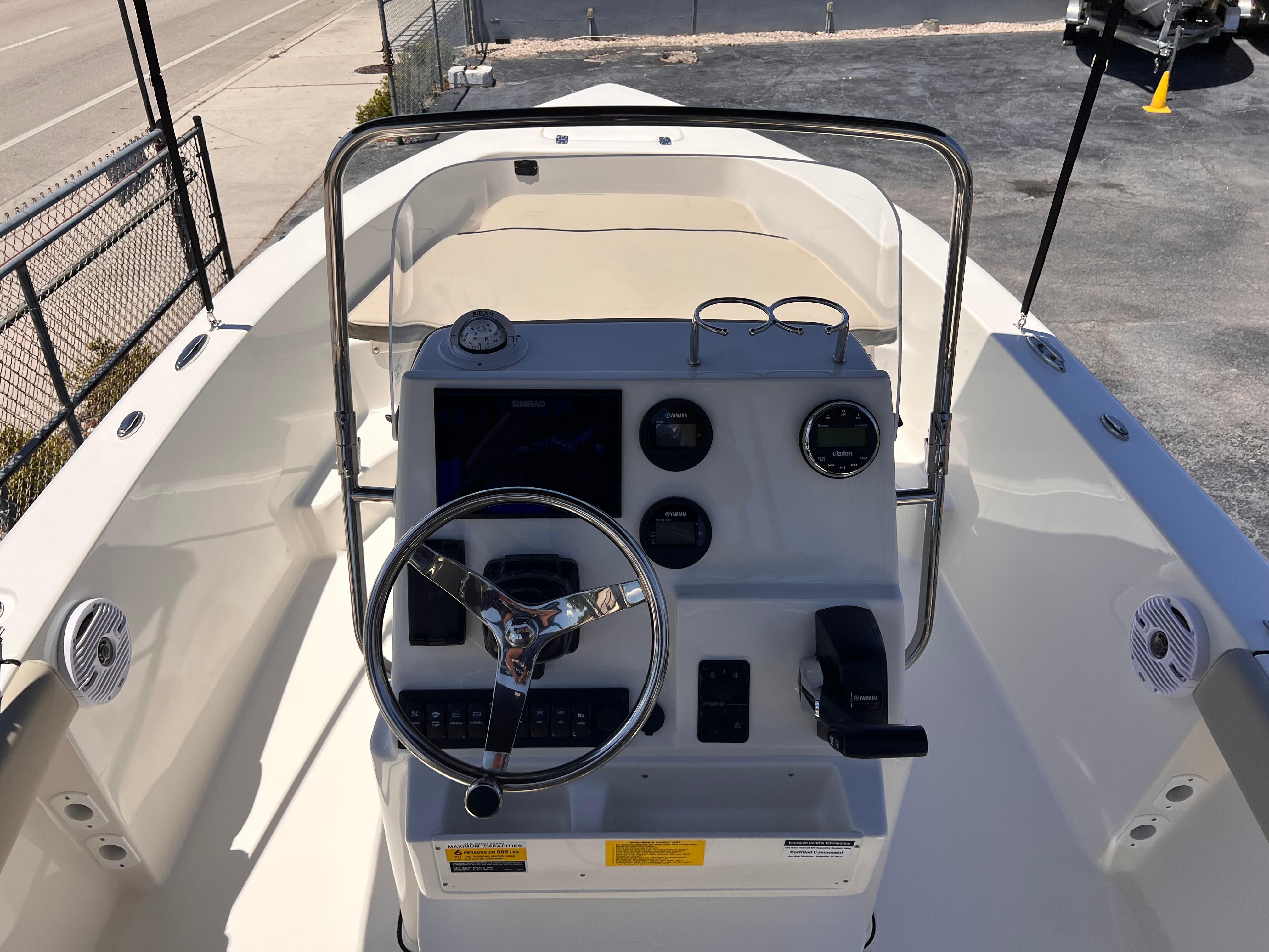 2025 Key West 179 FS boat console with steering wheel and gauges.