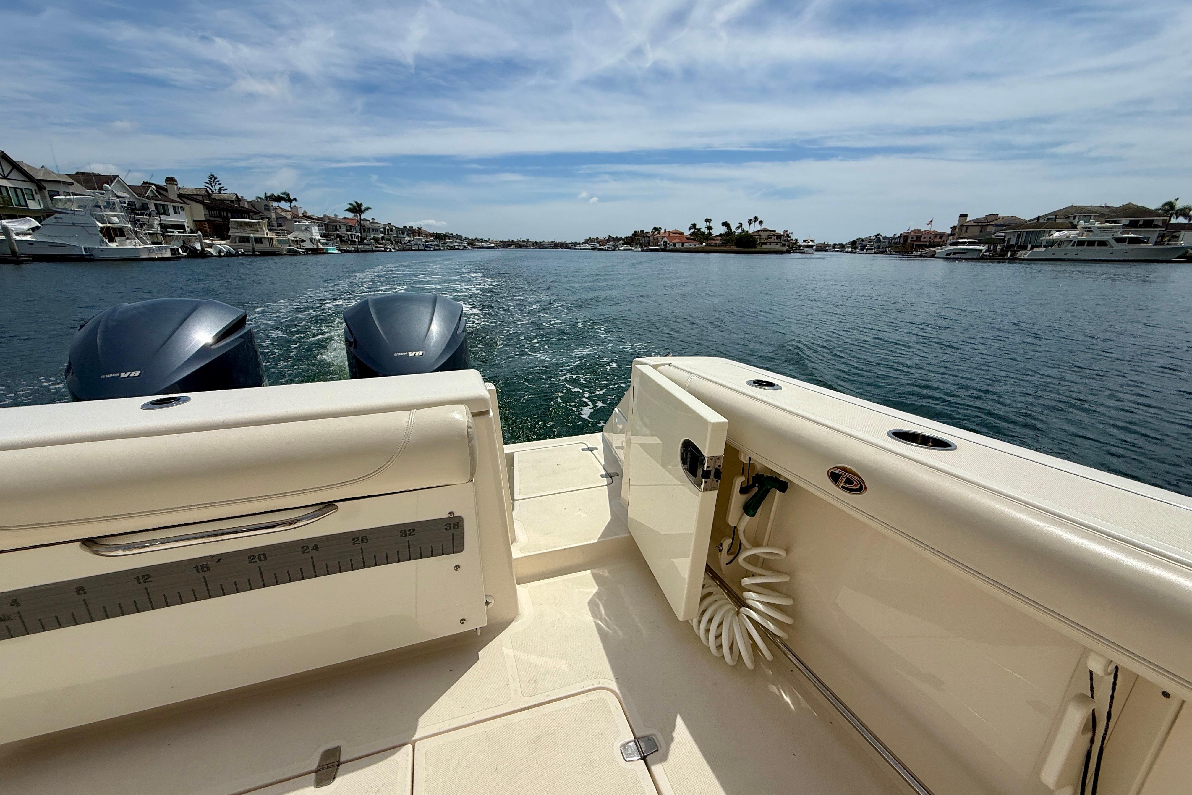 2012 Pursuit OS 345 Offshore boat cruising in a scenic coastal waterway.