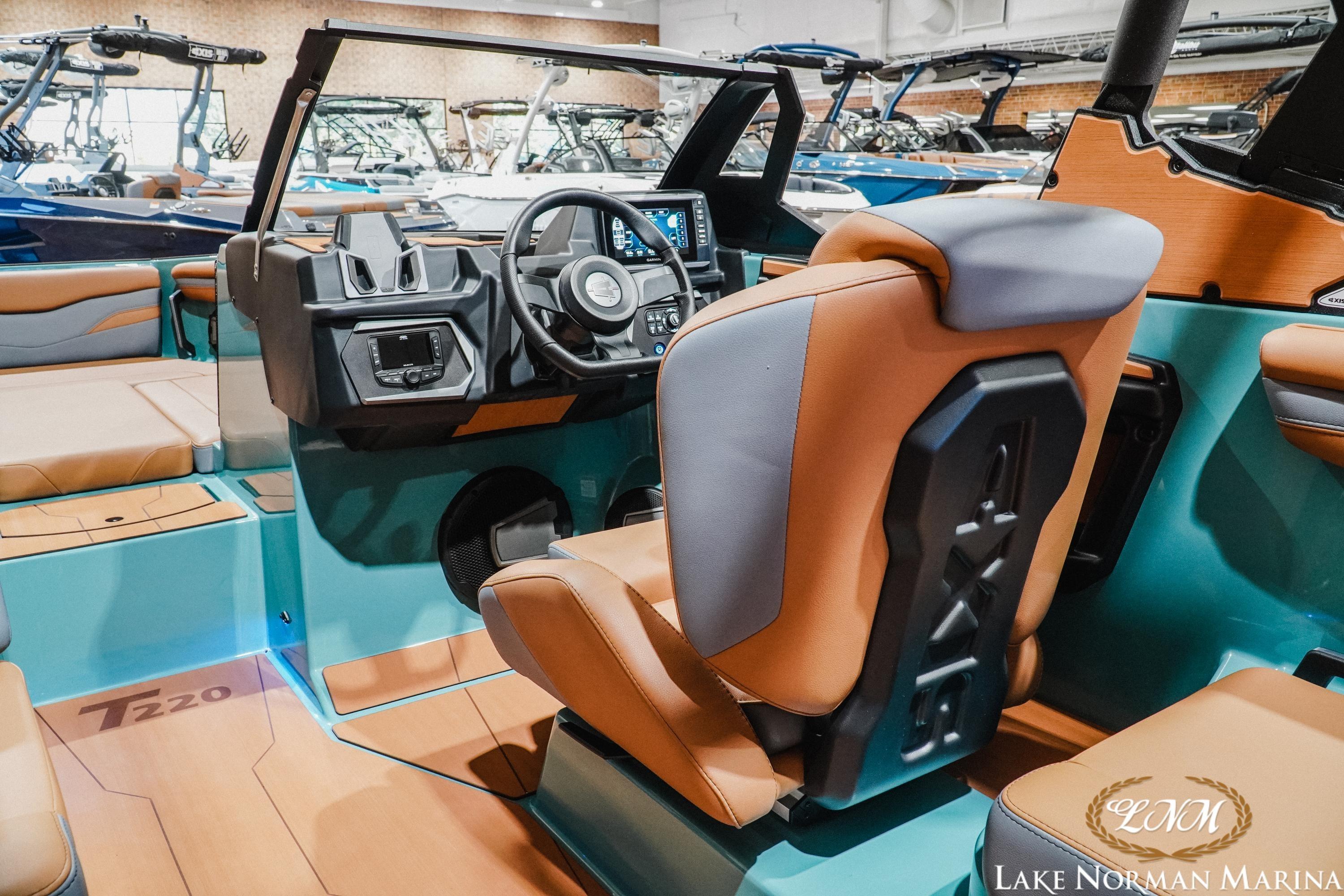 Interior of a 2026 Axis T220 boat showcasing modern dashboard and seating at Lake Norman Marina.