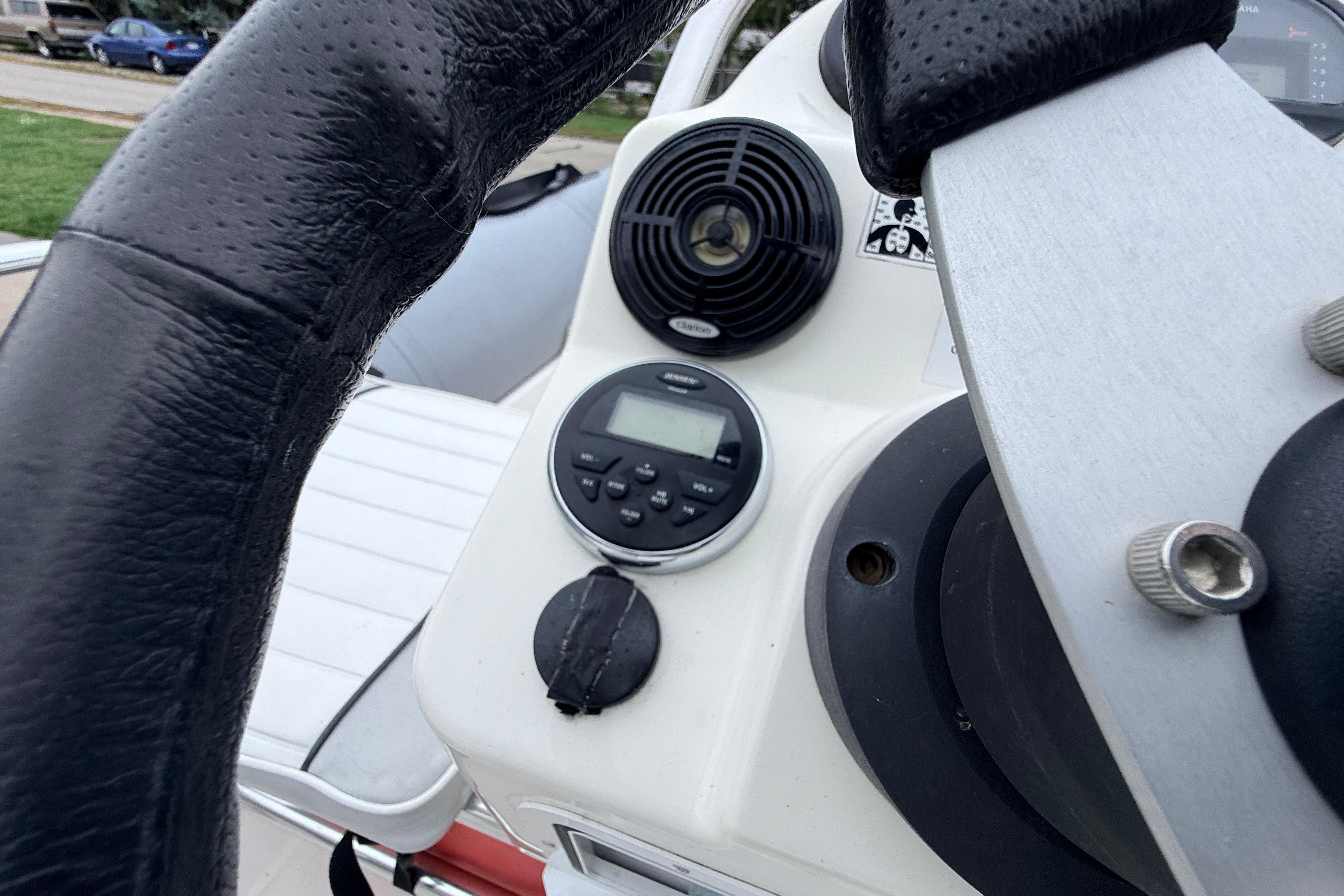 Close-up of Zodiac Pro Classic 420 boat dashboard, featuring steering wheel and control panel.