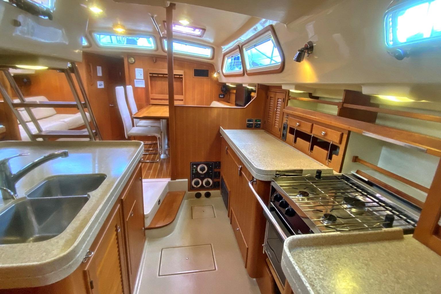 Luxurious 2006 Island Packet 485 yacht interior with modern kitchen and dining area.