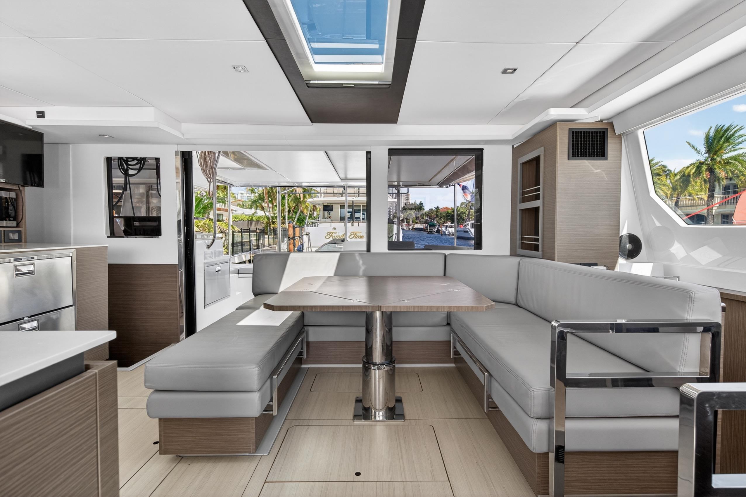 Luxurious interior of 2022 Leopard 50 yacht with modern seating and skylight.