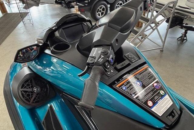 2026 Yamaha WaveRunner FX Cruiser SVHO, teal color, detailed dashboard view in showroom.