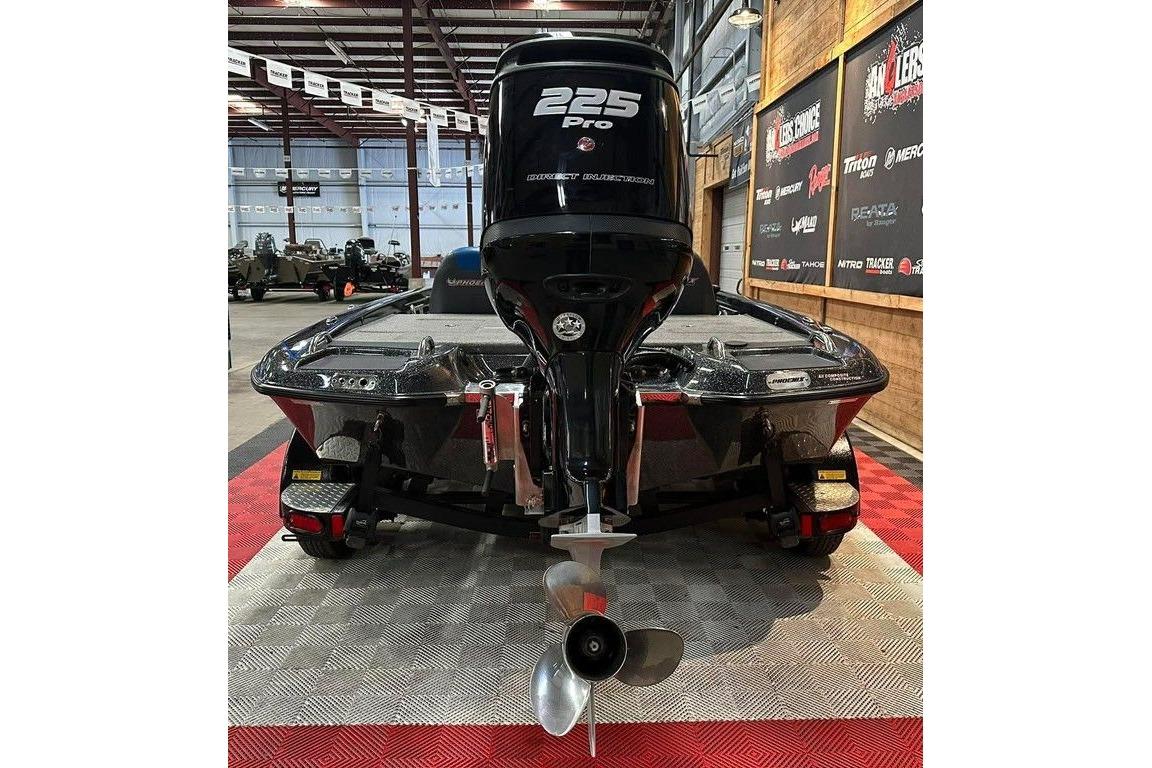 2017 Phoenix 919 ProXP boat with 225 Pro engine in showroom setting.