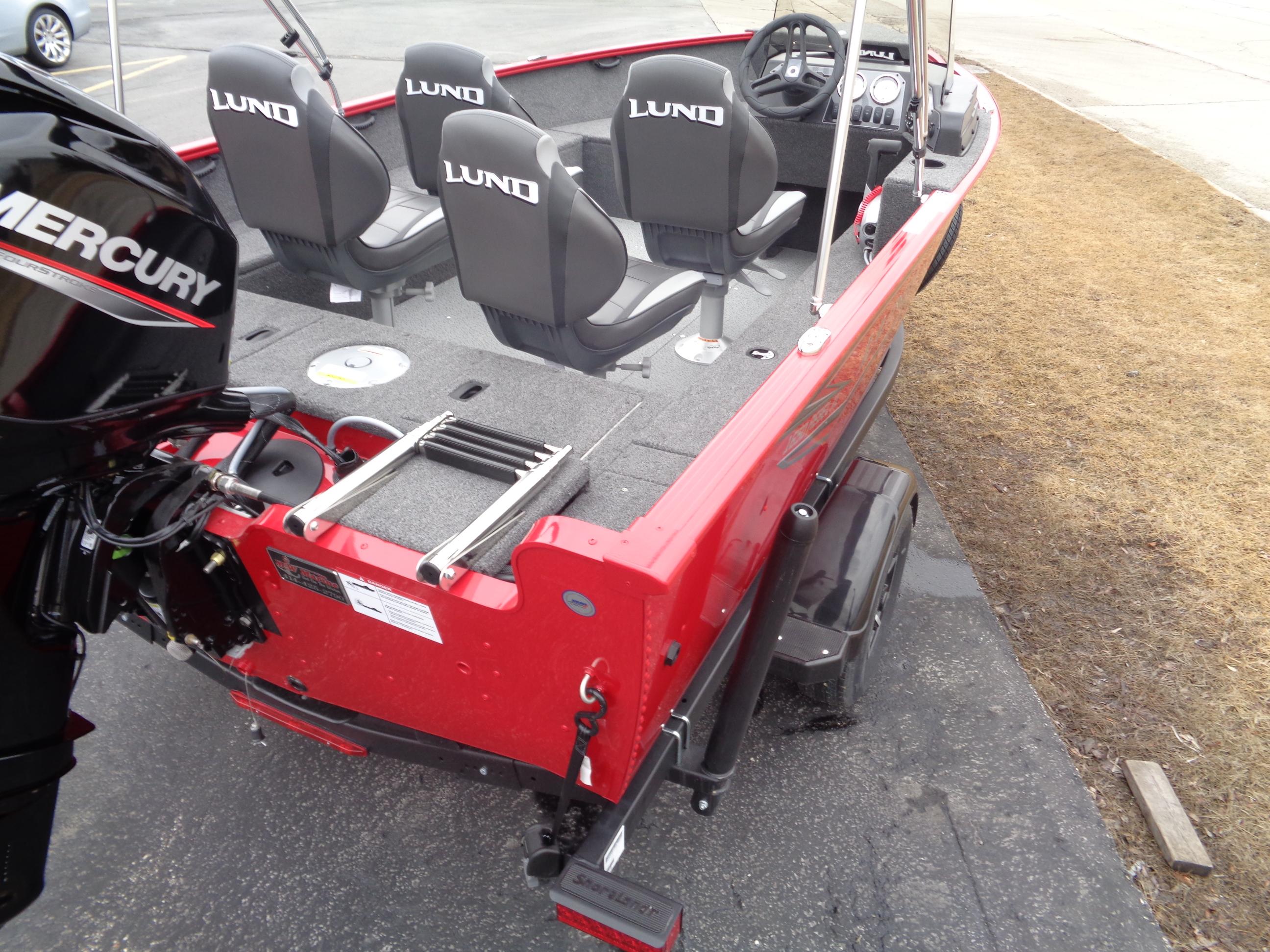 2025 Lund 1650 Rebel XL SS boat, red exterior, Mercury engine, four seats, docked on pavement.