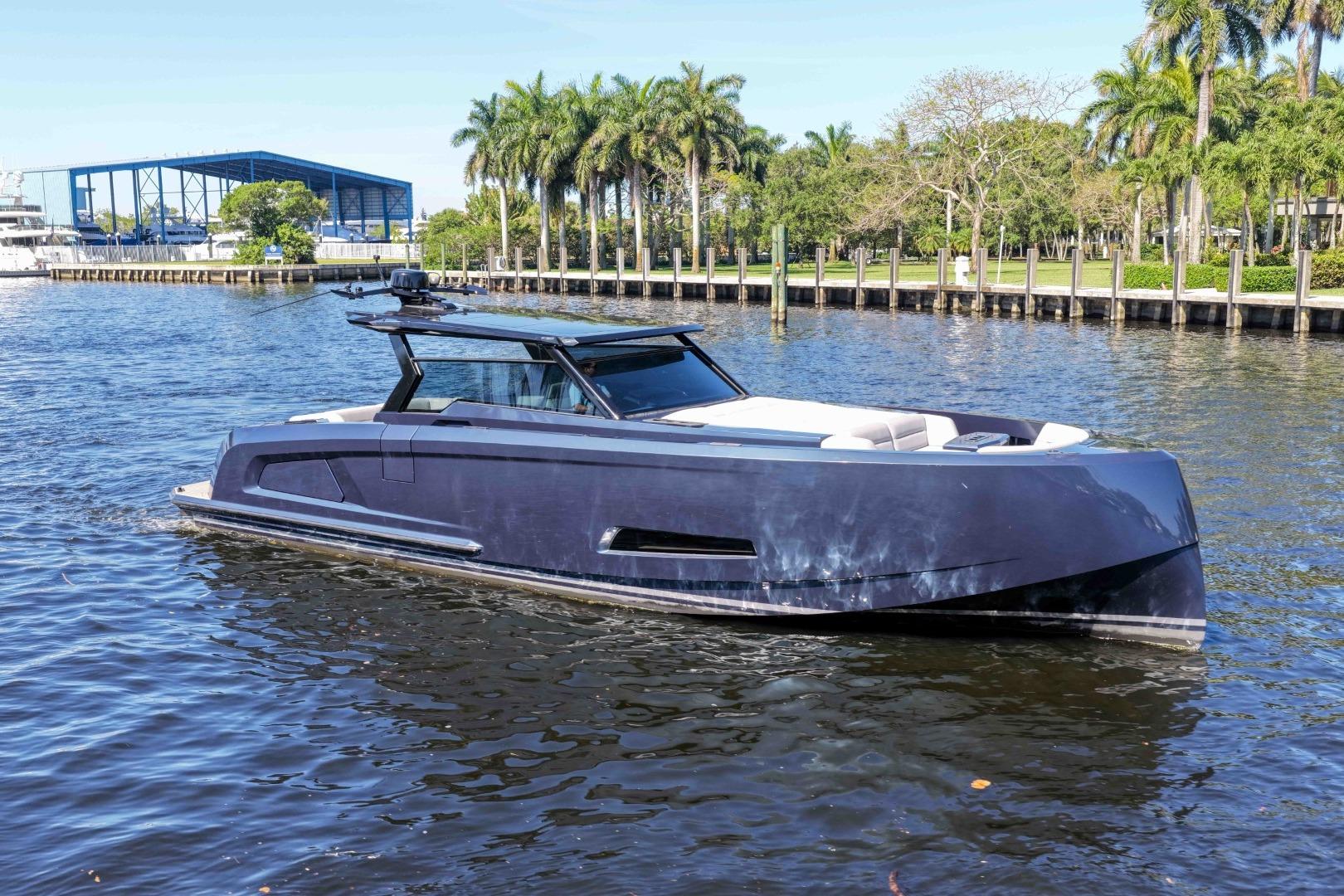 2022 Vanquish Yachts VQ45 luxury yacht cruising on a scenic waterway.