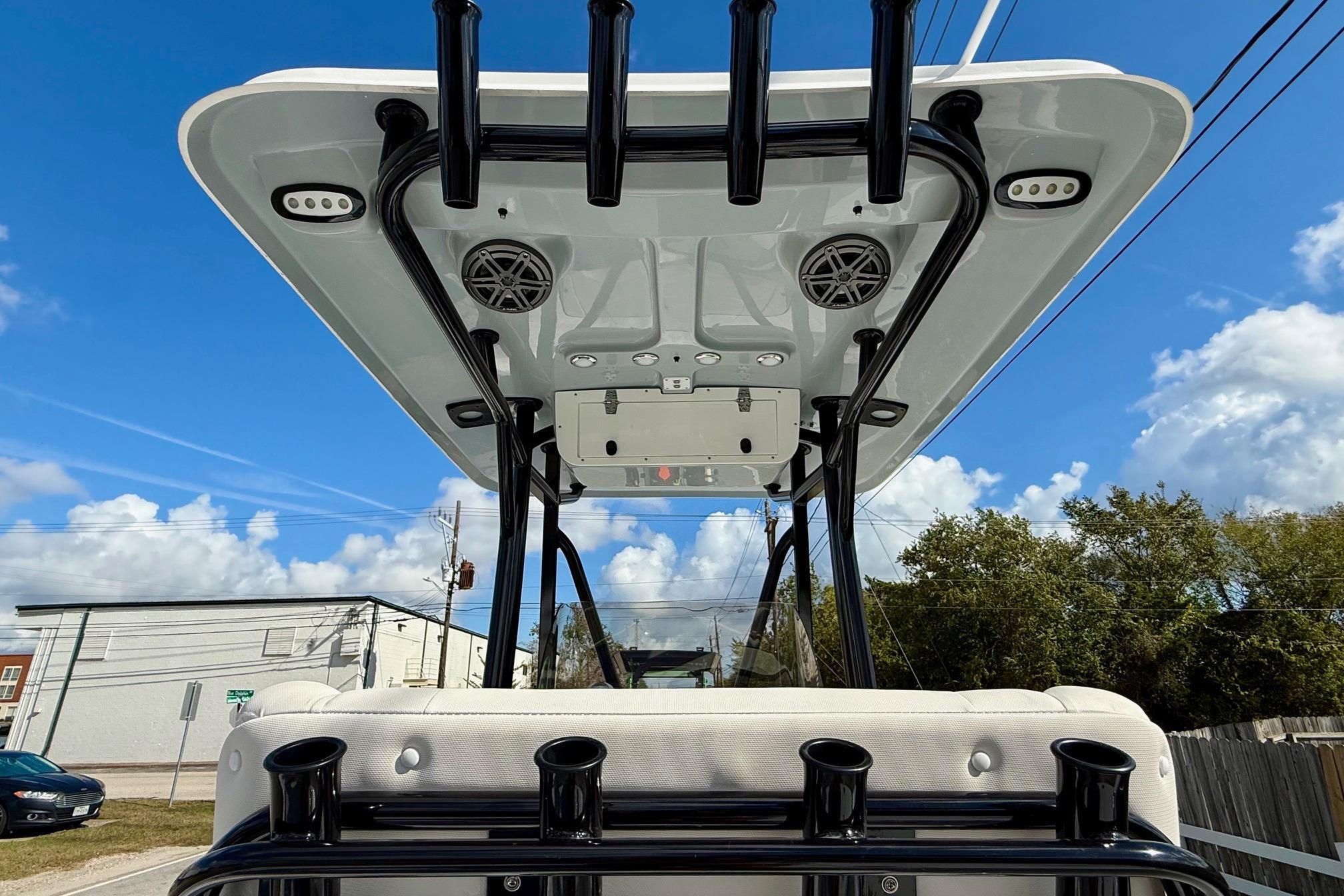2026 Sea Hunt BX 22 BR boat with T-top and rod holders under a clear blue sky.