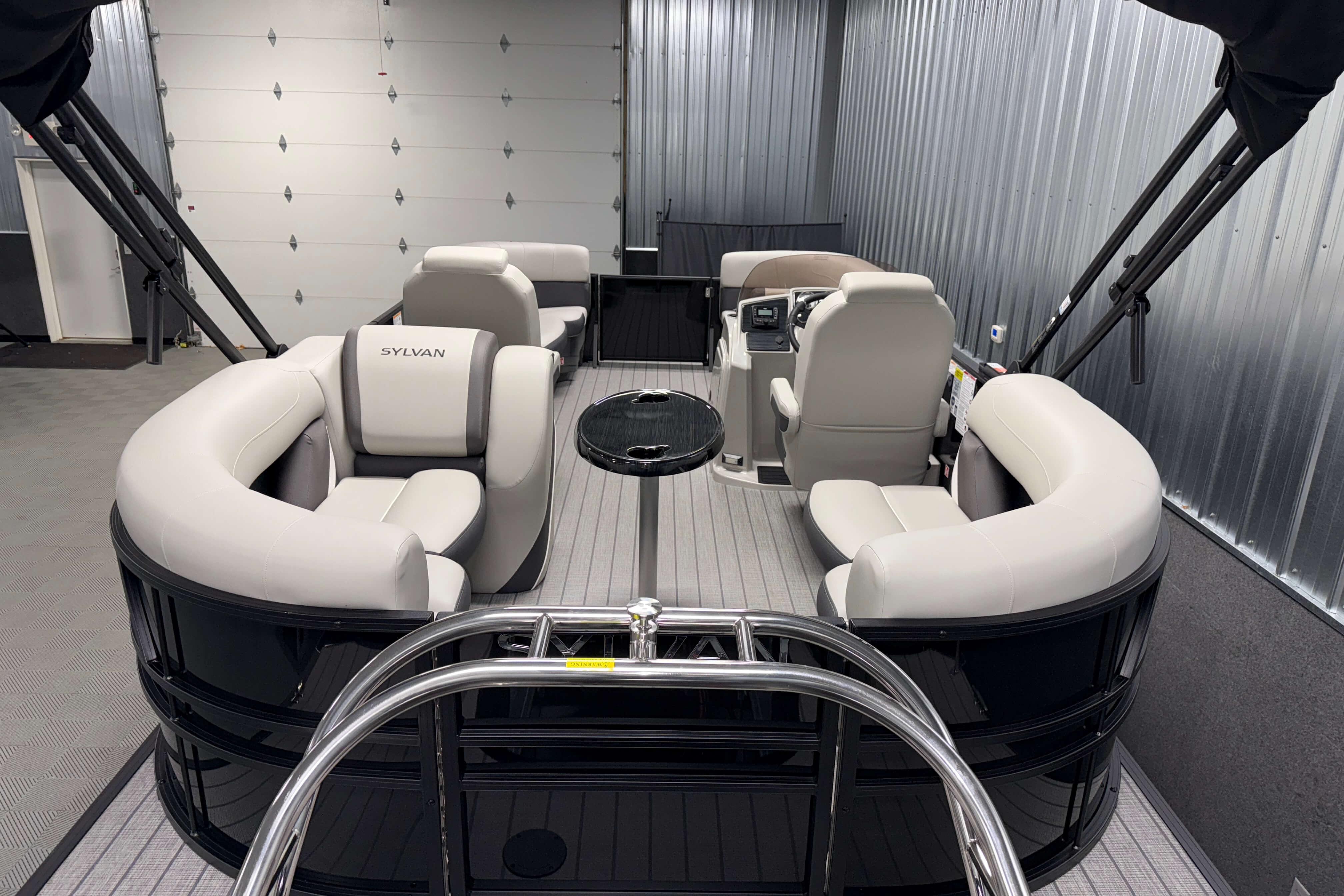 2026 Sylvan Mirage X1 pontoon boat interior with plush seating and modern design.