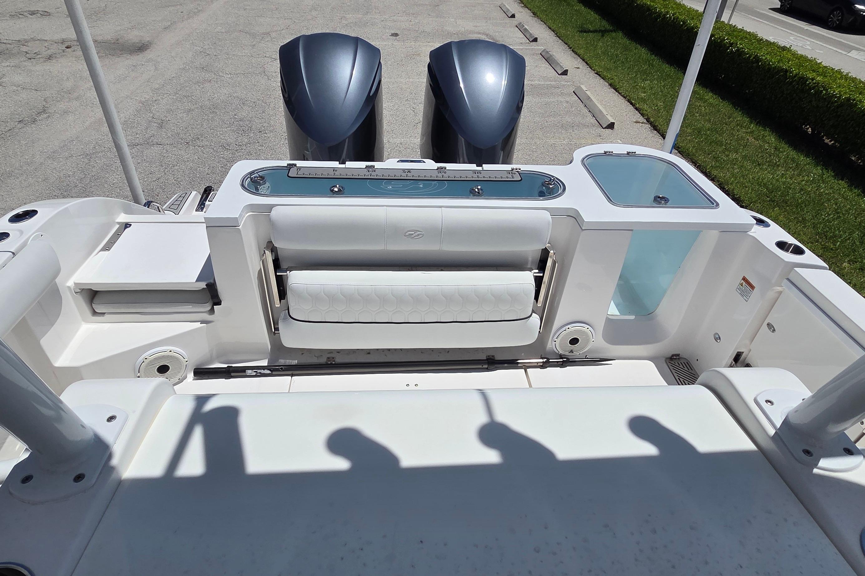 2021 Sea Fox 328 Commander boat deck with dual engines and seating area.