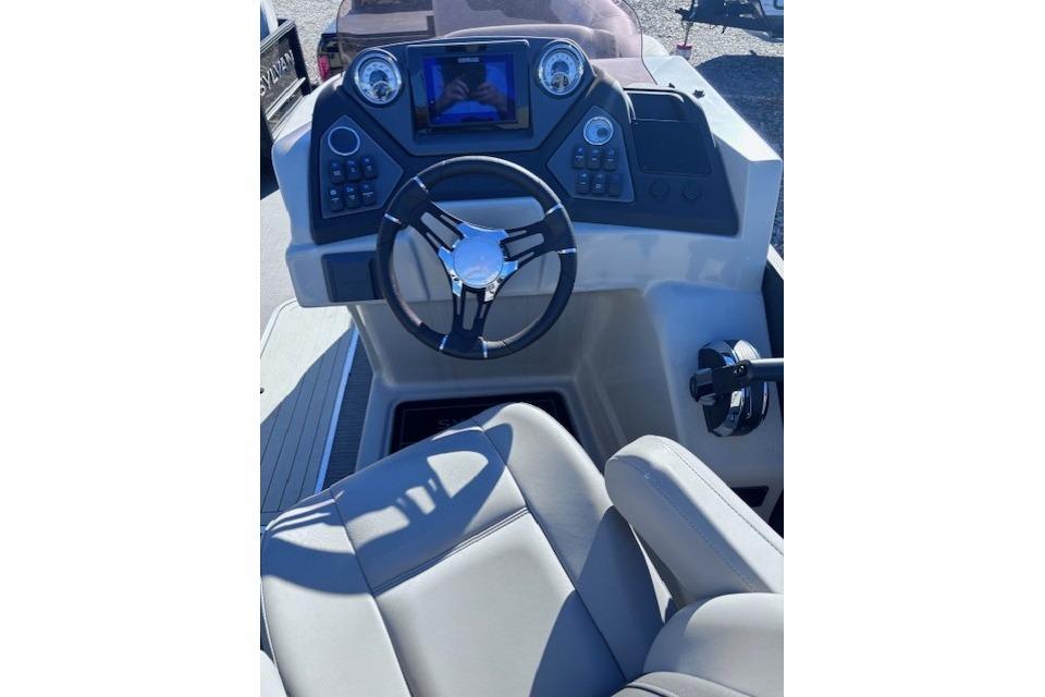2022 Sylvan L3 DLZ Bar boat dashboard with steering wheel and controls.