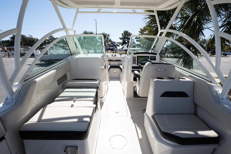 2023 Sailfish 245 DC boat interior with seating and helm, showcasing modern design.