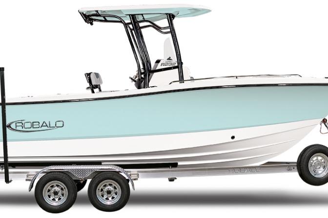 2025 Robalo R232 Explorer boat on trailer, side view, light blue hull.