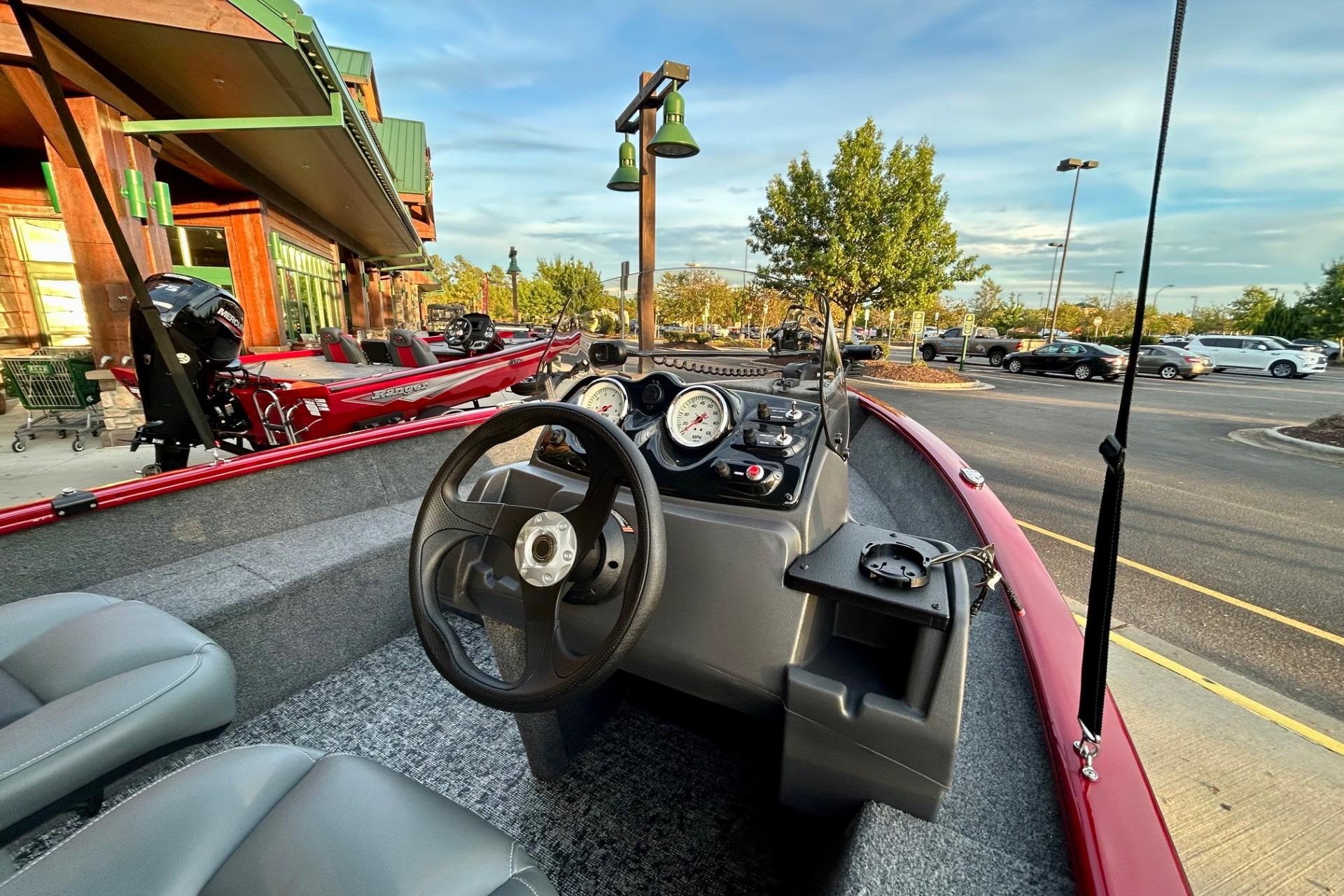 2026 Tracker Super Guide V-16 SC boat interior with steering wheel and dashboard.