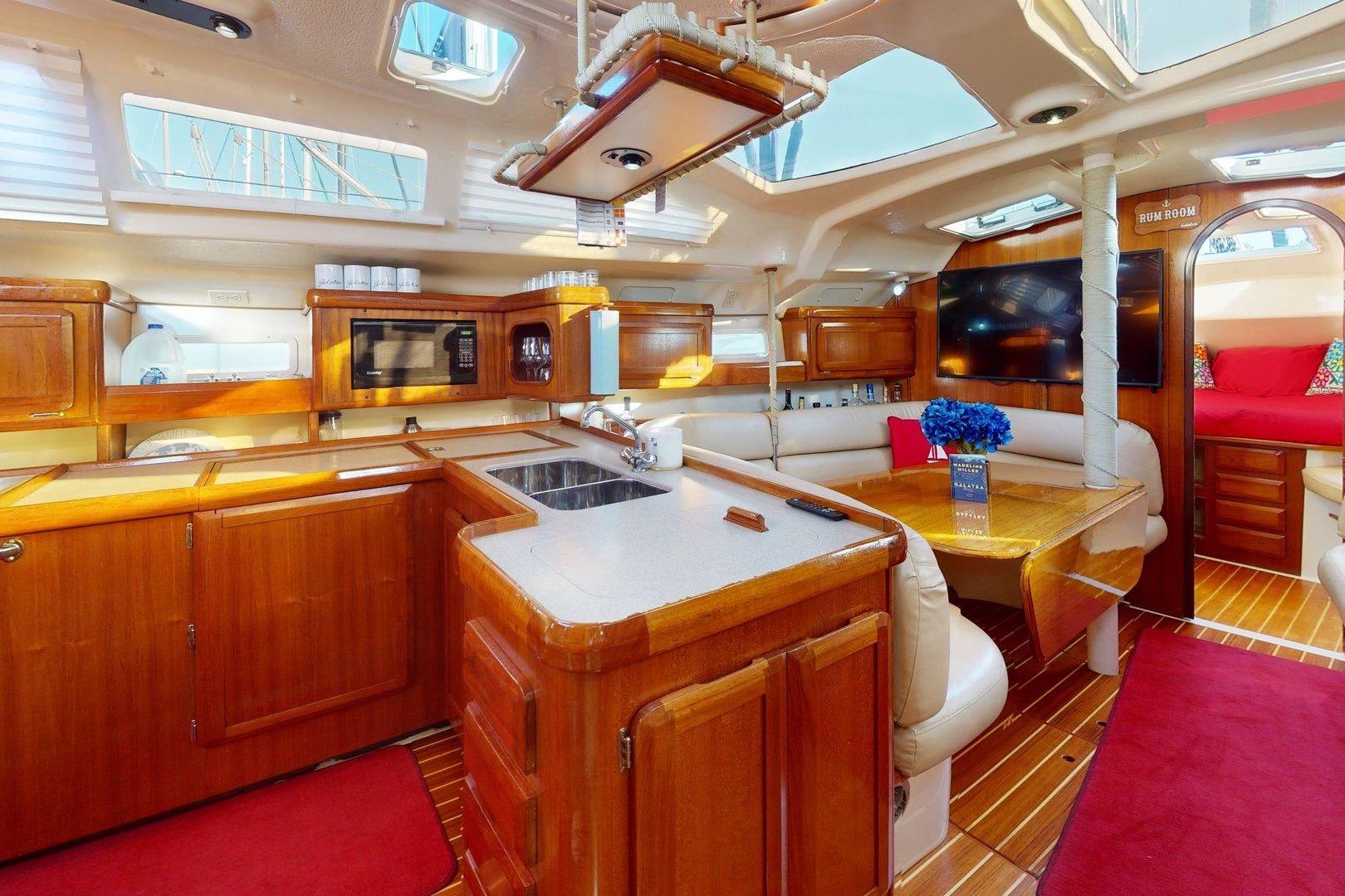 Luxurious interior of a 1997 Hunter Legend 40.5 yacht with elegant wood finishes.
