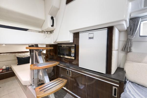 Manufacturer Provided Image: Interior of 2023 Sea Ray Sundancer 320 yacht with modern kitchen and seating area.