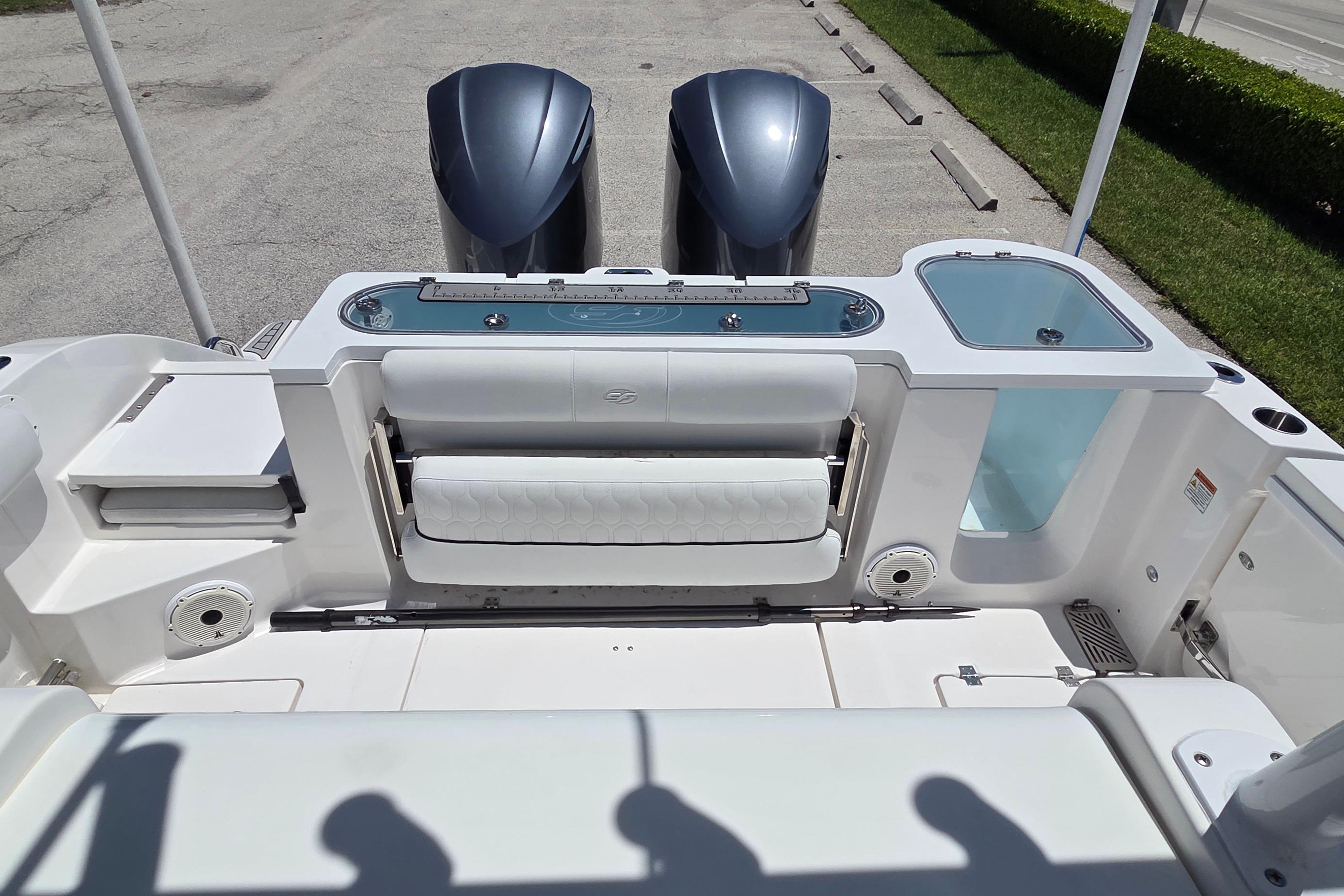 2021 Sea Fox 328 Commander boat interior with dual engines and seating area.