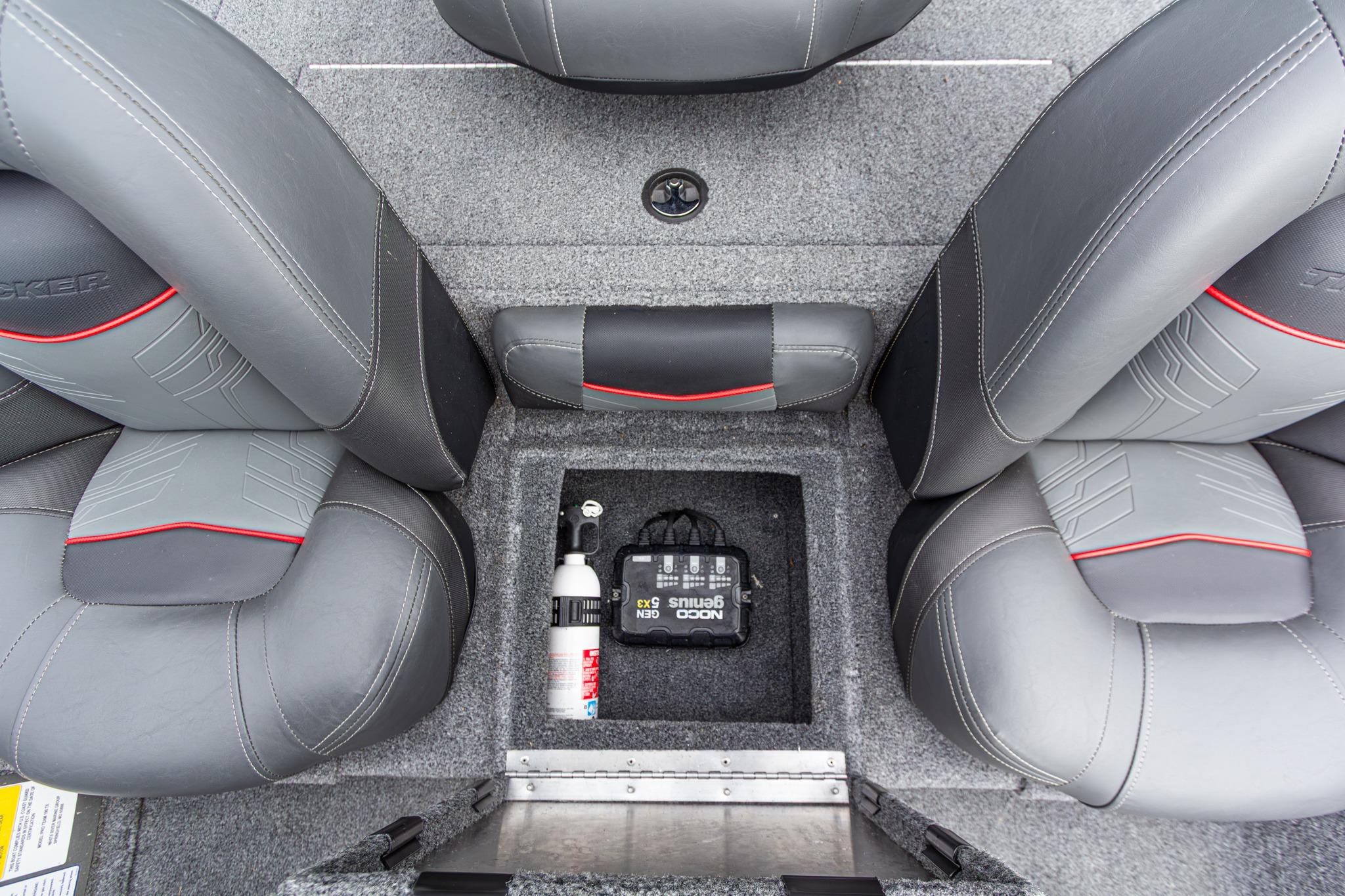 2023 Tracker Pro Team 190 TX boat interior with gray seats and storage compartment.
