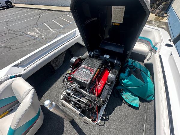 1992 Correct Craft Ski Nautique boat engine compartment with open cover, showing detailed engine view.