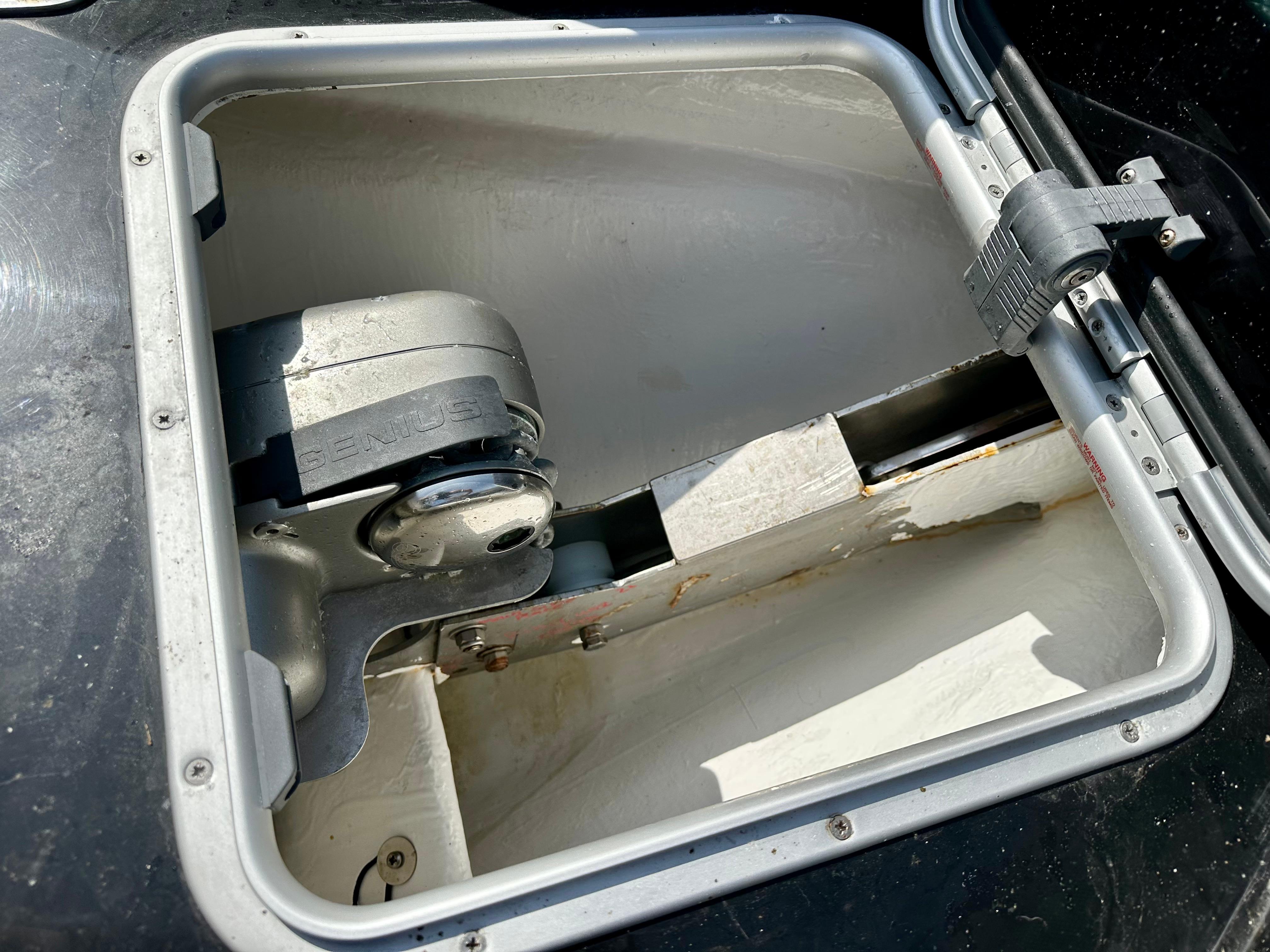 Open storage compartment in a 2021 Ribquest Explorer boat.
