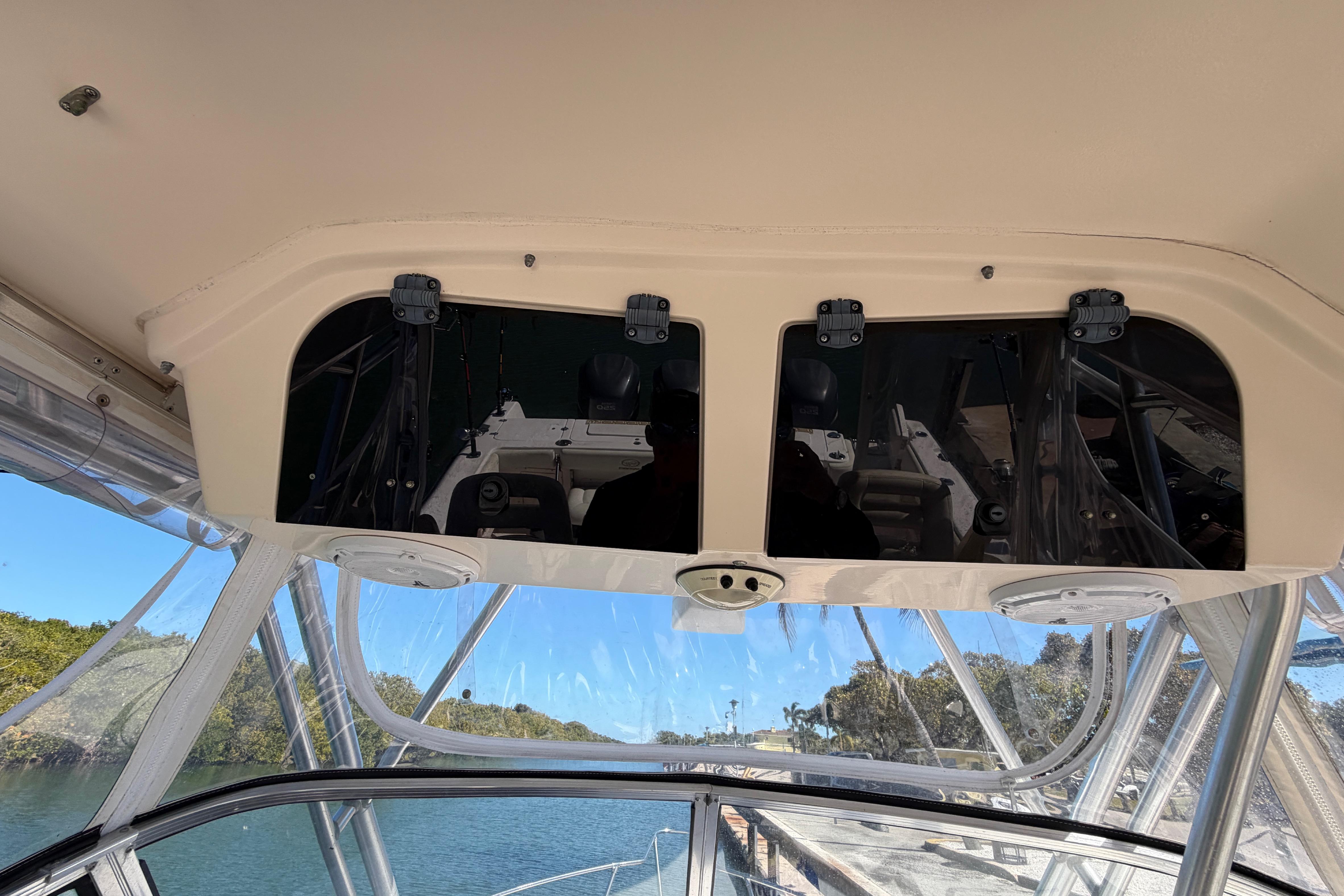 2006 Grady-White Sailfish 282 boat interior with overhead storage and clear canopy.
