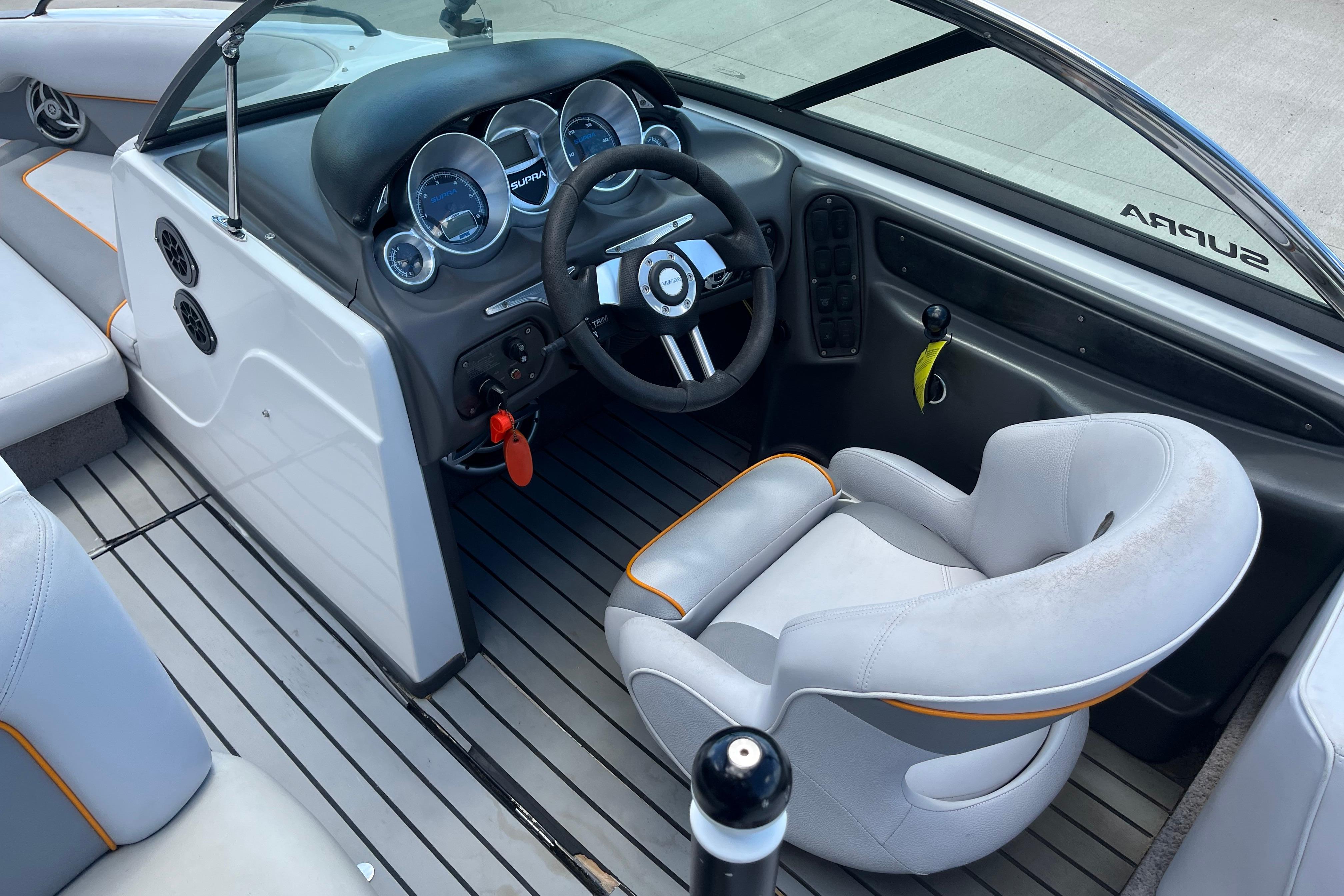 Interior of a 2008 Supra Launch 20 boat with steering wheel and dashboard.