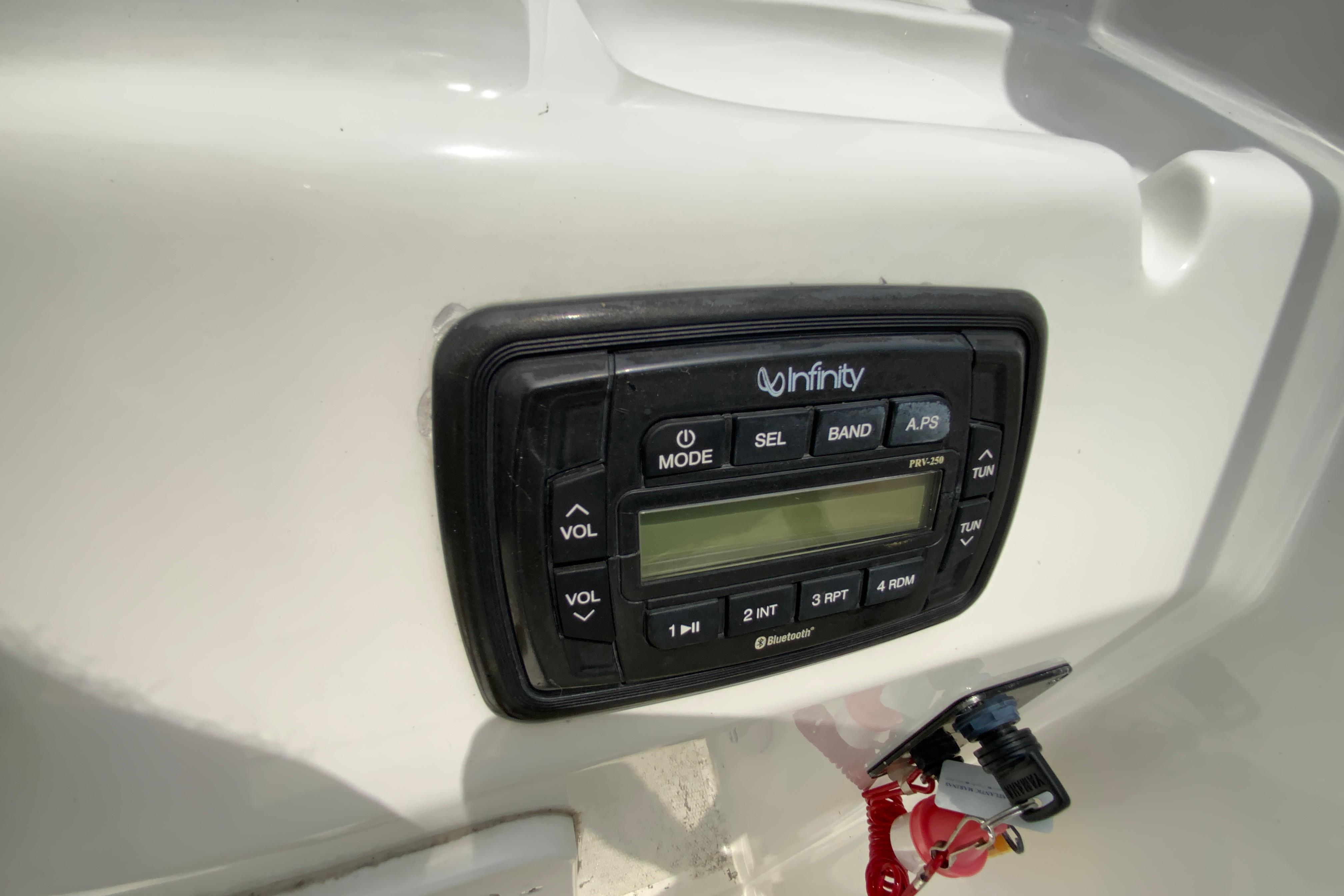 Infinity stereo system on 2014 Sea Hunt Escape 211 LE boat dashboard.