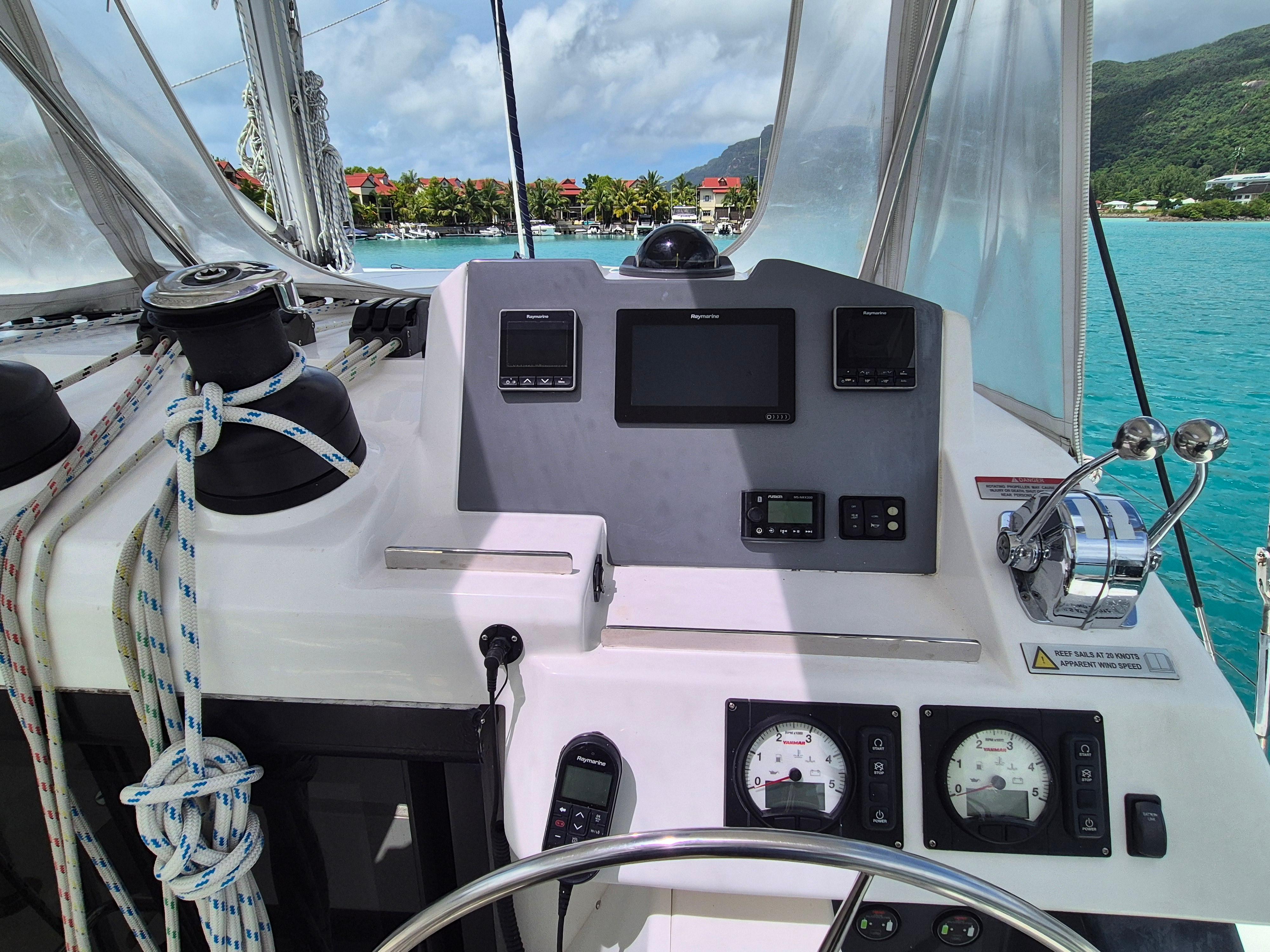 Control panel of a 2020 Leopard 50 yacht with ocean and island view.