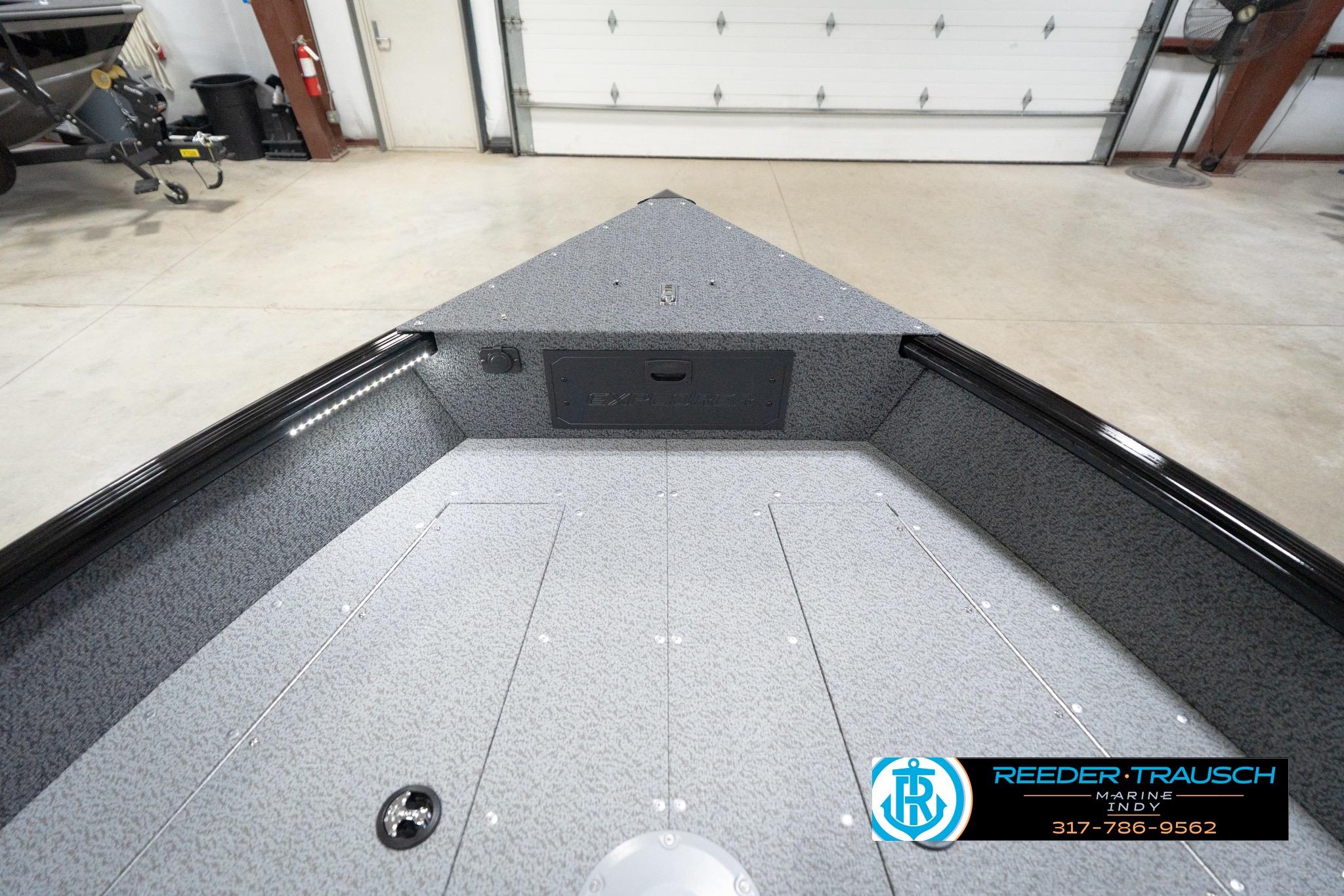 2026 Lund 1800 Explorer Sport boat interior in a showroom setting.