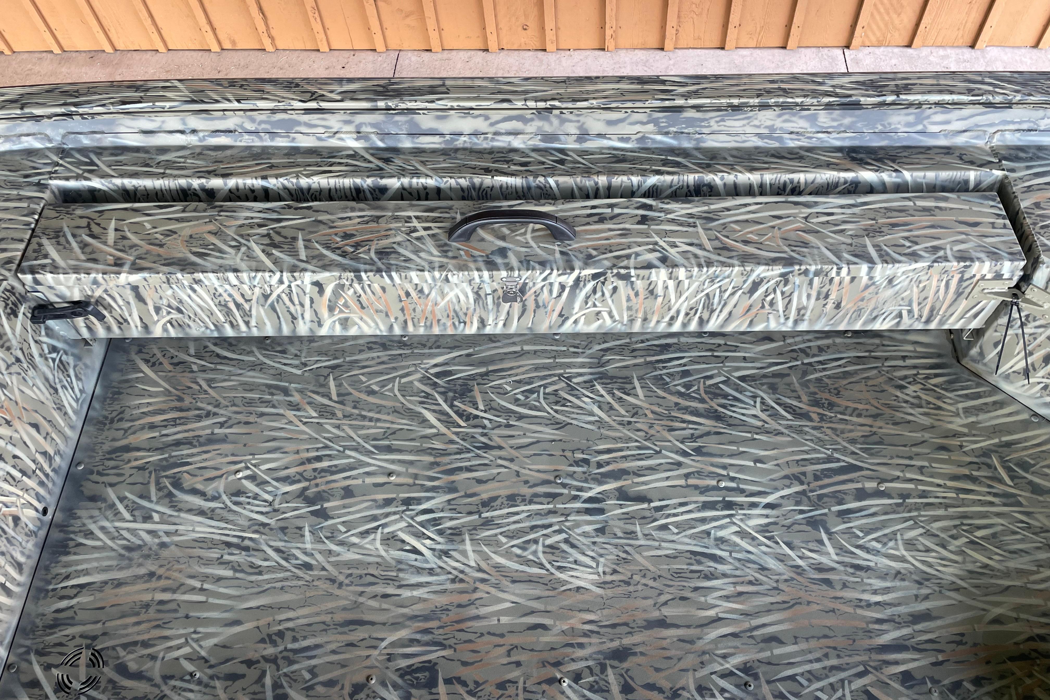 2026 Tracker Grizzly 1654 T Sportsman boat interior with camouflage pattern.