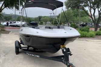 2026 Tahoe T16 boat on trailer, sleek design, parked outdoors.