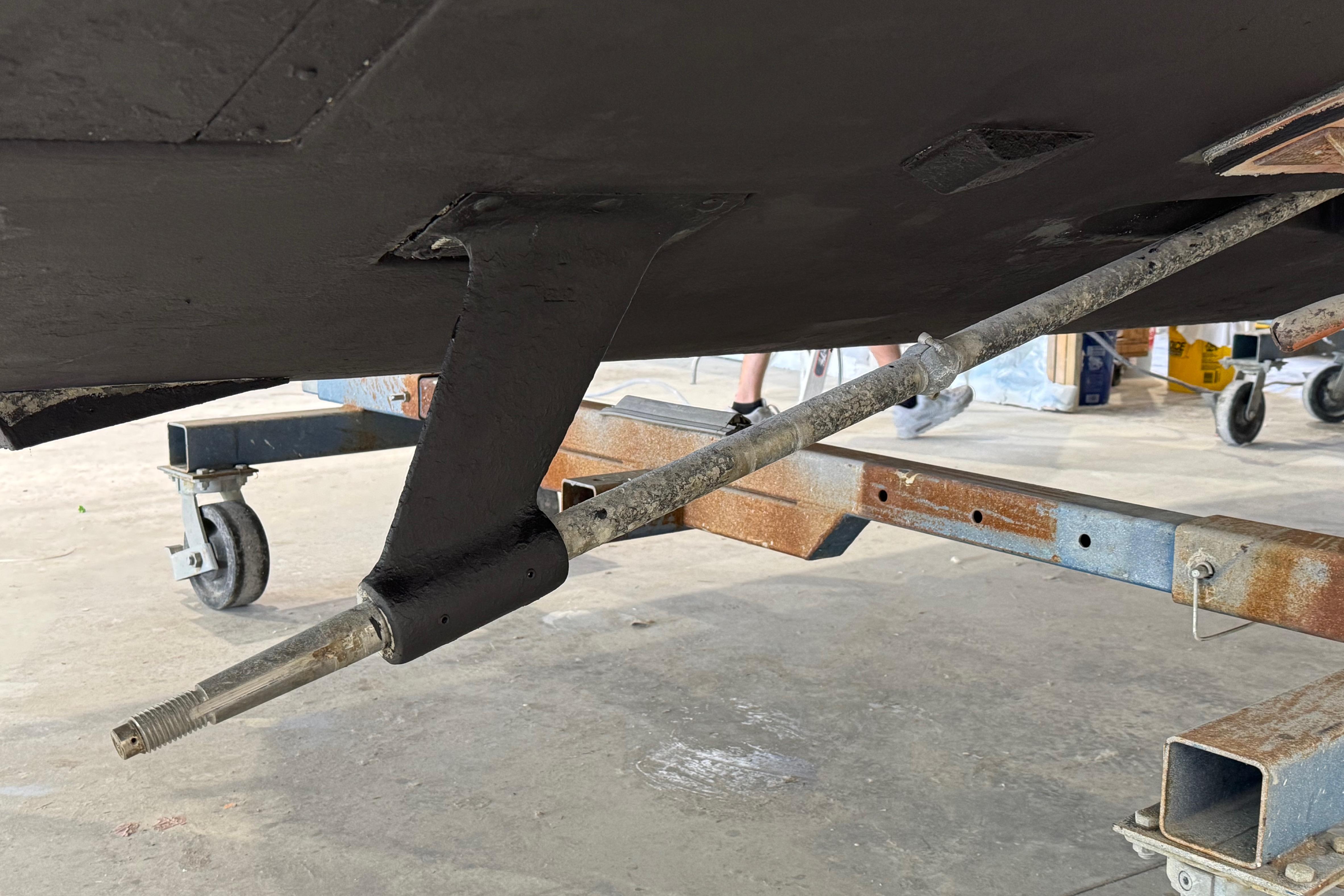 2011 Luhrs 30 Open boat underbody with visible propeller shaft and support structure.