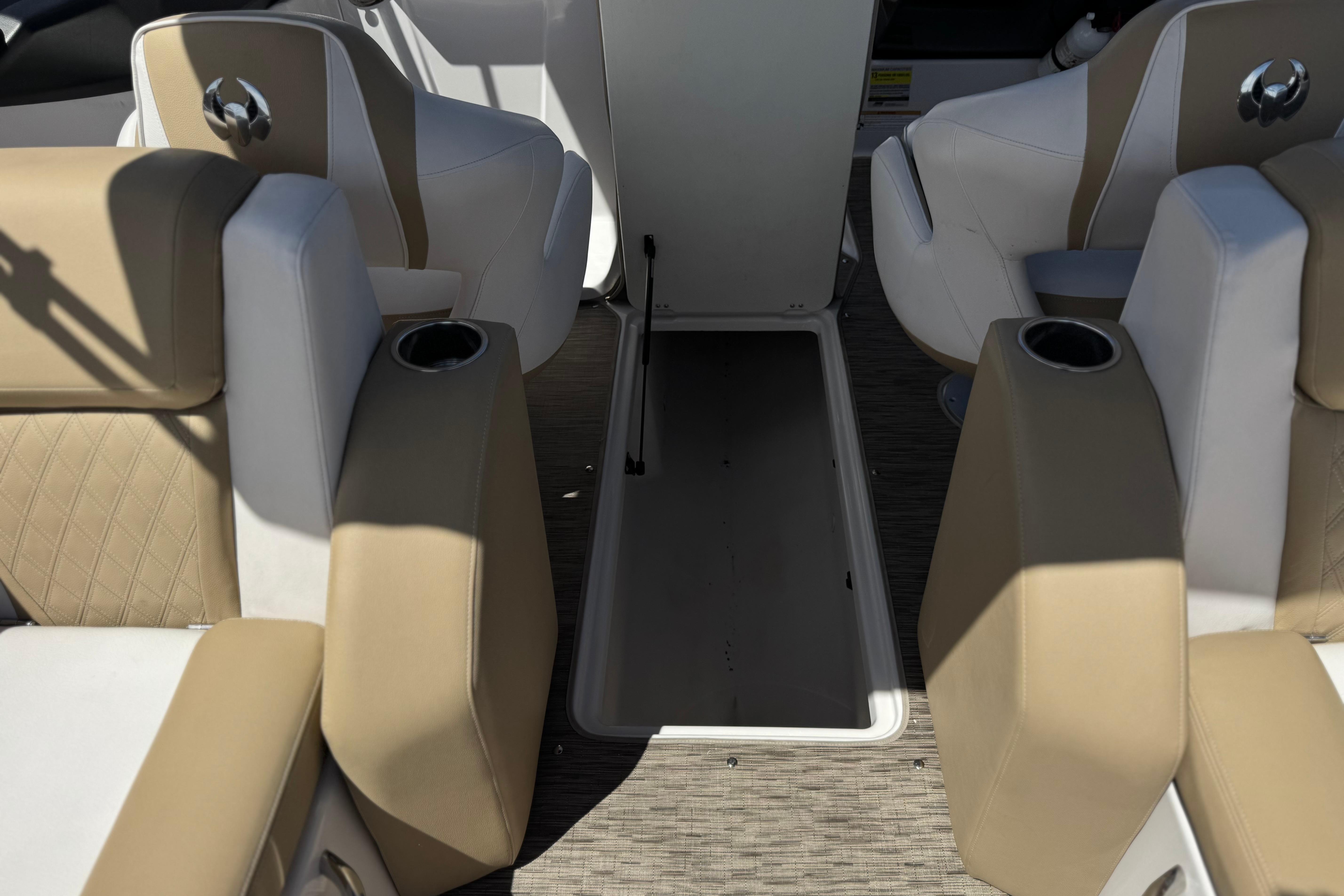 Interior of 2017 Scarab 255 H.O. Platinum boat with beige and white seating.