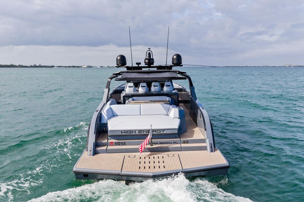 2024 Vanquish Yachts VQ55 cruising on open water, rear view.