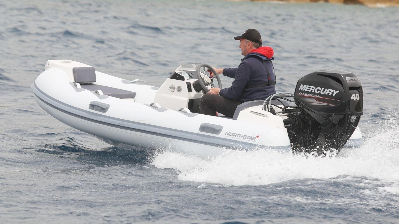 2021 Northstar Axis 3.4 inflatable boat with Mercury 40 outboard engine on water.