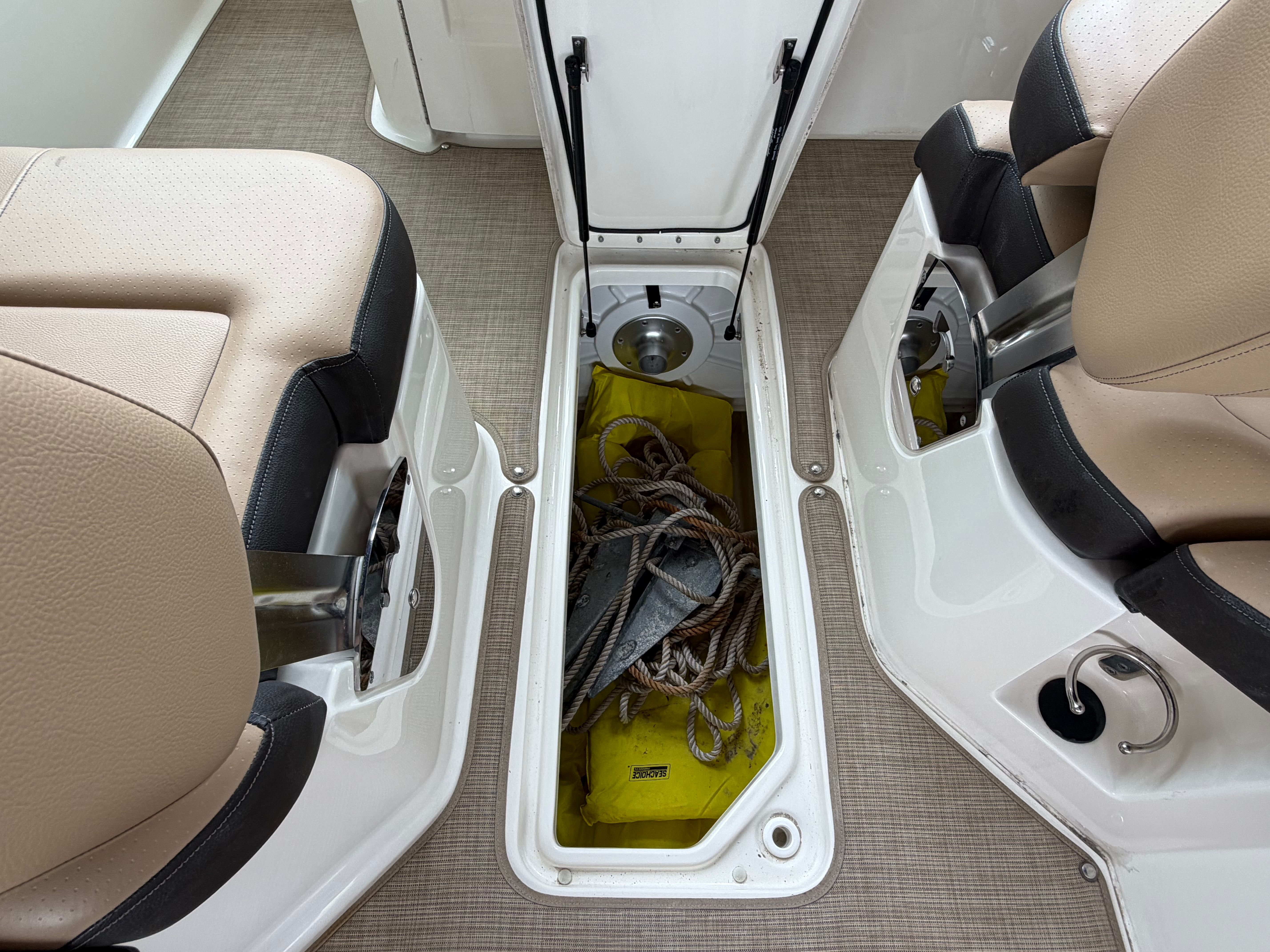 Storage compartment in Sea Ray SDX 250 Outboard boat, year 2020.