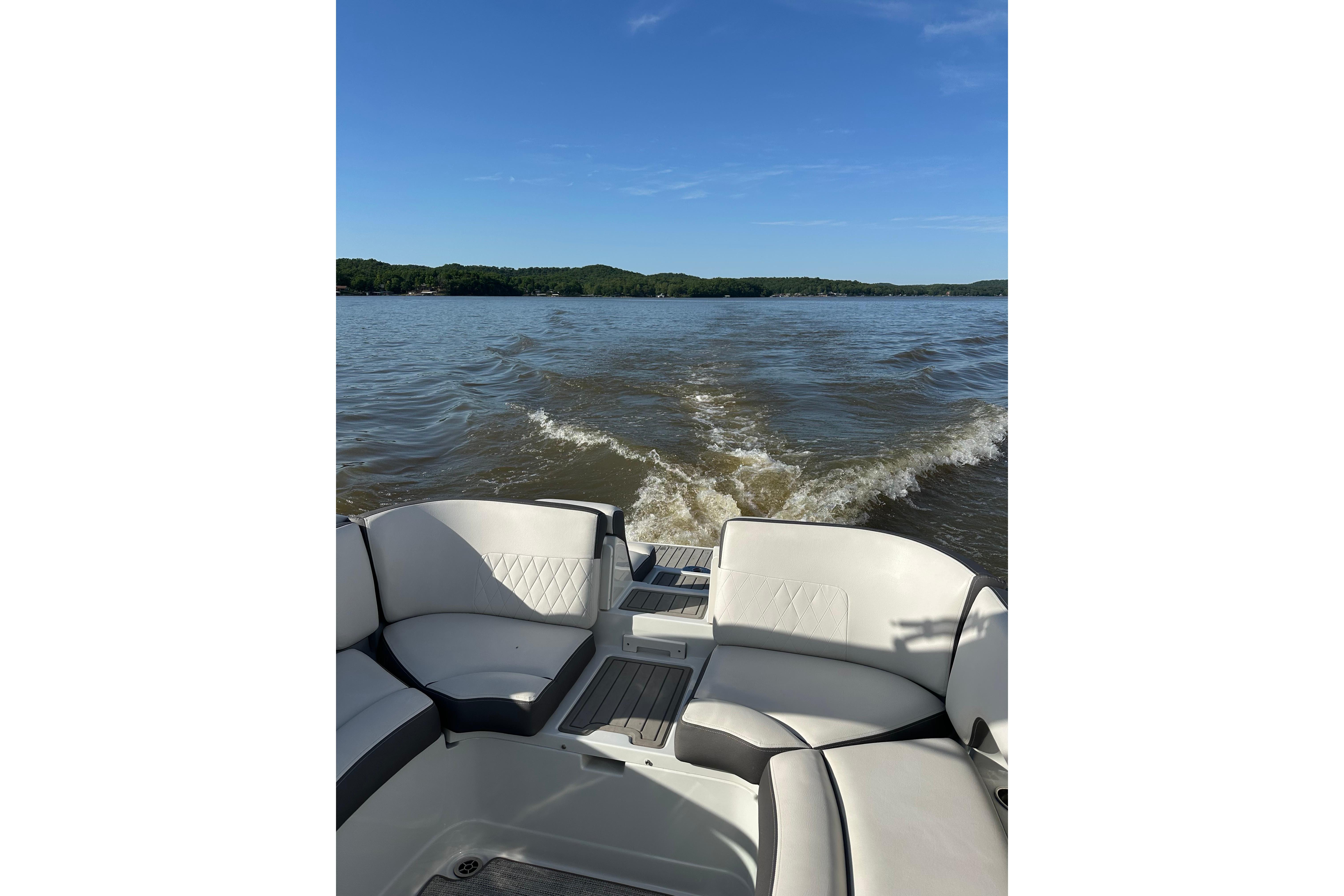 2022 Crownline 265 SS boat interior with lake view and wake trail.