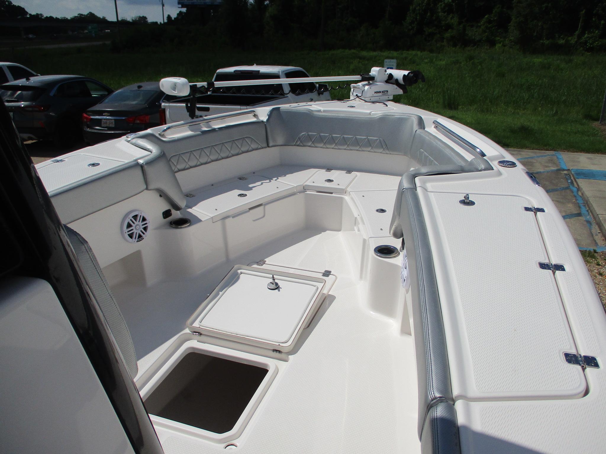 2024 Blue Wave 2800 Makaira boat interior with seating and storage compartments.