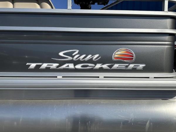 2025 Sun Tracker FB 20 DLX logo on a sleek boat exterior.