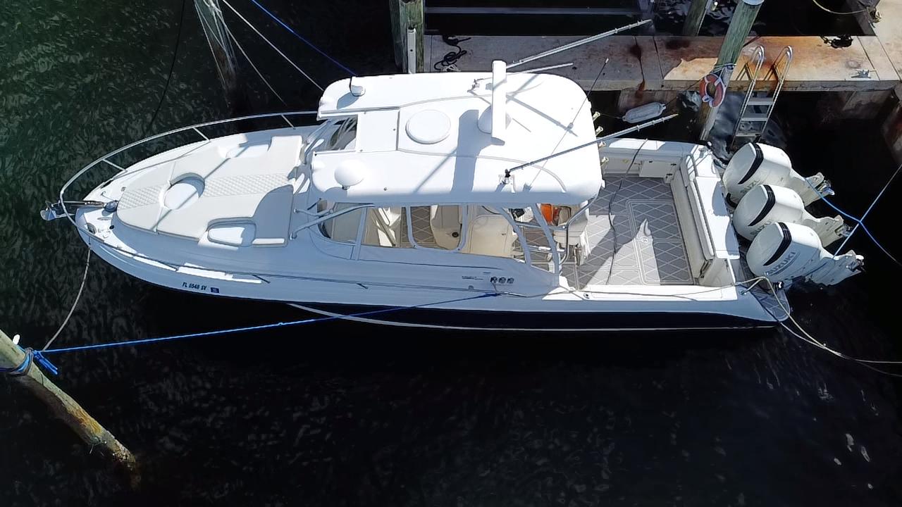 2006 Hydra-Sports Vector 3300 VX boat docked, aerial view, featuring twin outboard engines.
