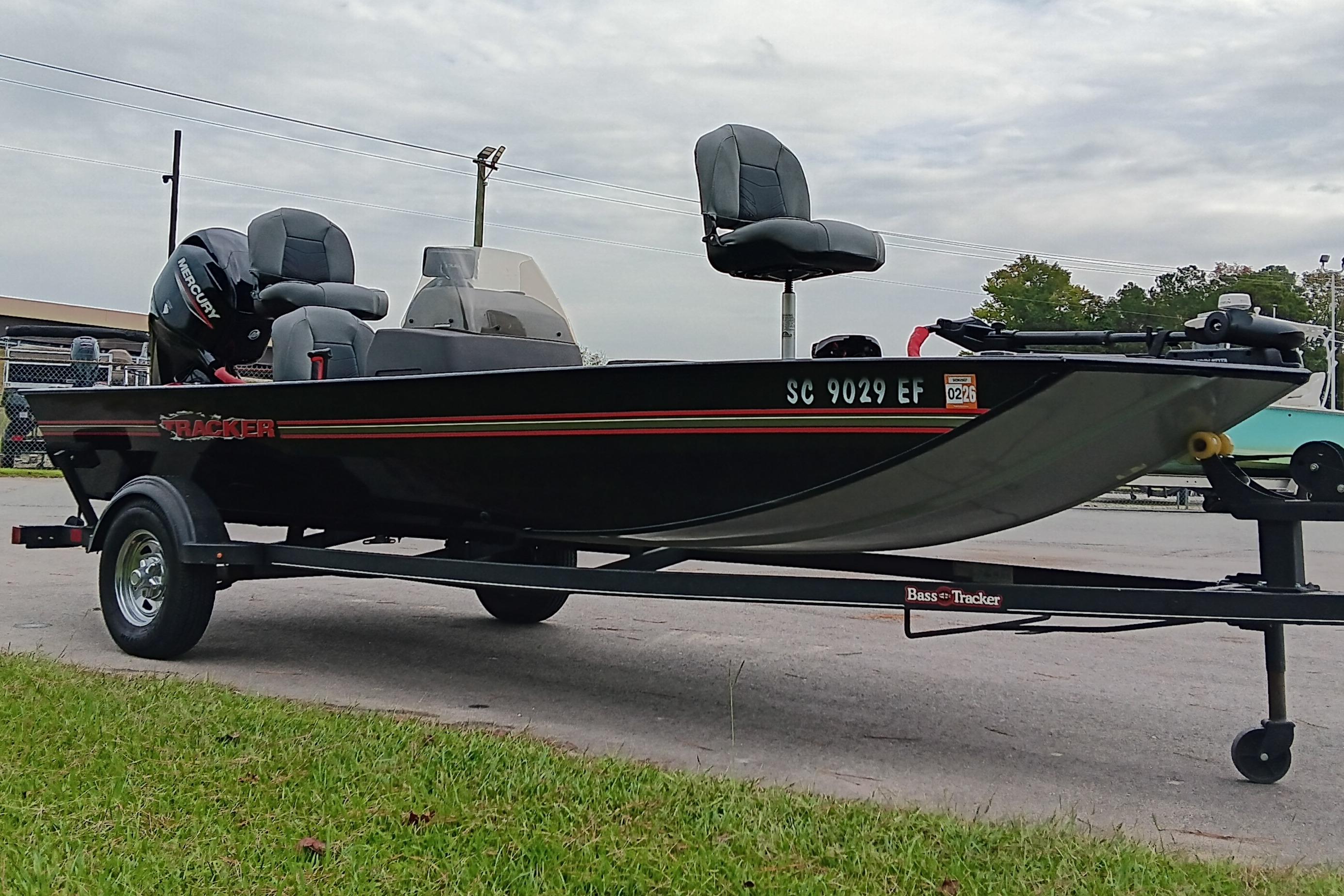 2023 Tracker Bass Tracker Classic XL boat on trailer, parked outdoors.