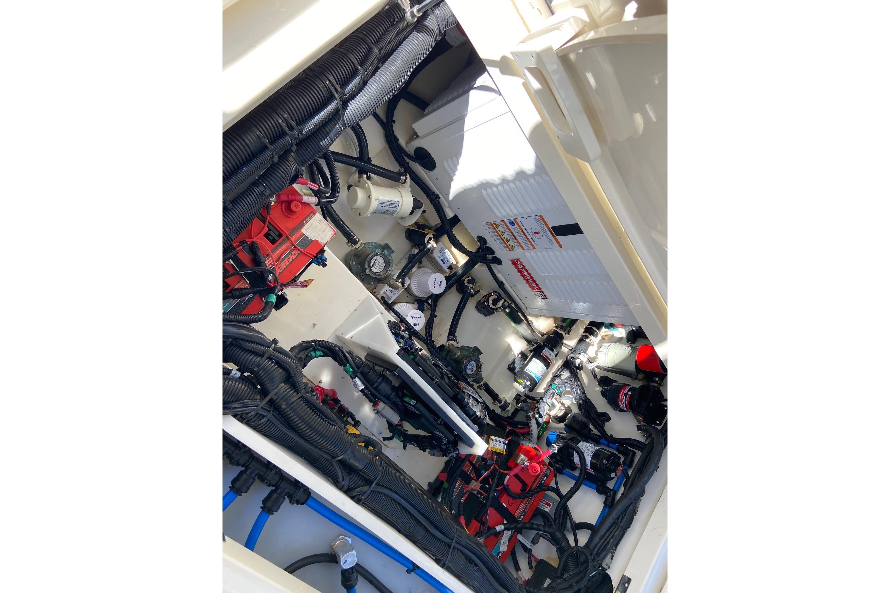 2024 Boston Whaler 320 Vantage engine compartment with wiring and components.
