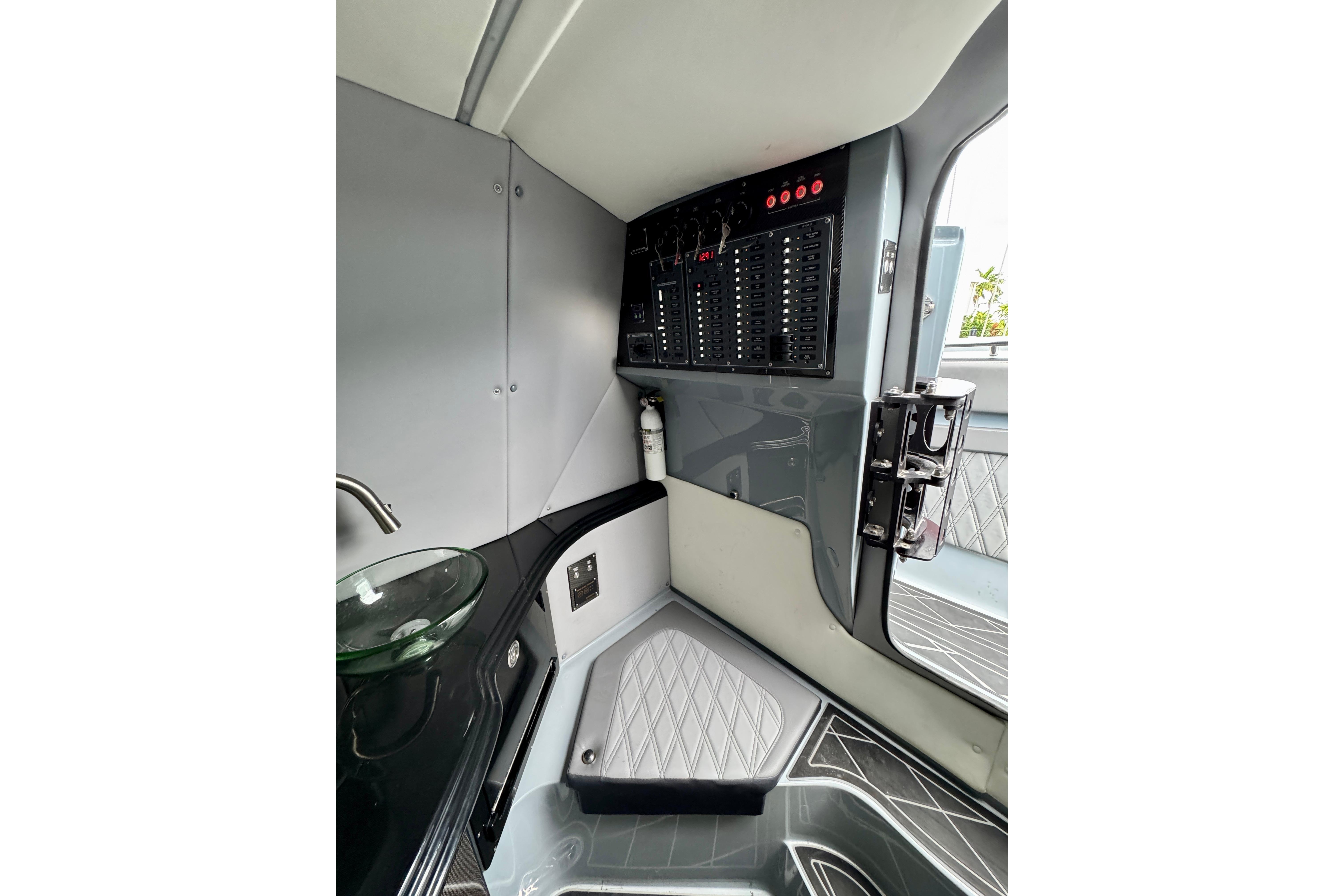 Interior of 2019 MTI V42 boat featuring control panel and modern design elements.