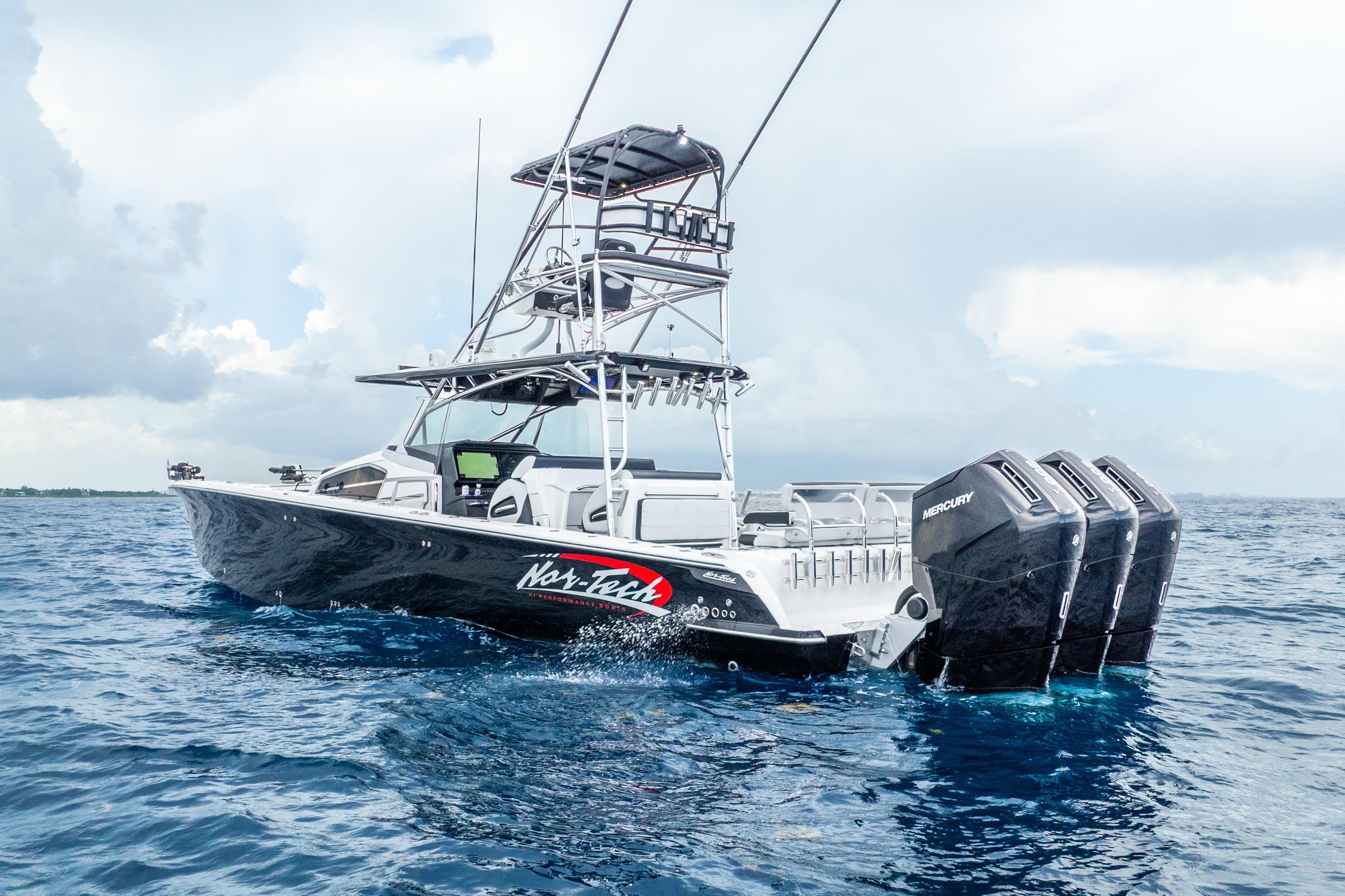 2024 Nor-Tech 452 Super Fish boat with triple Mercury engines on open water.
