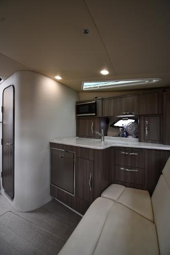 2021 Regal 35 Sport Coupe interior with modern kitchenette and seating area.
