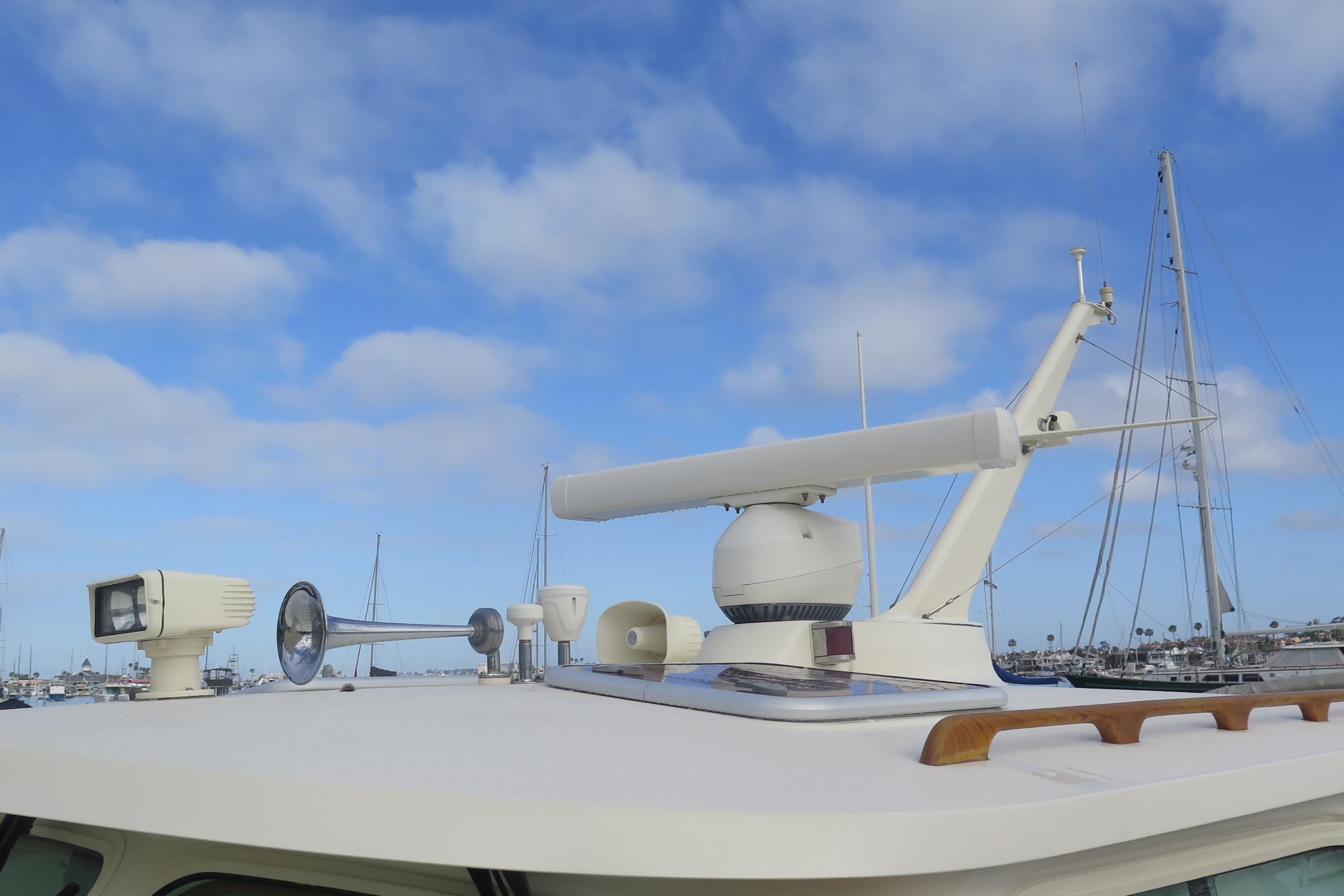 Hinckley Talaria 40 yacht, 2007 model, featuring radar and navigation equipment against a blue sky.