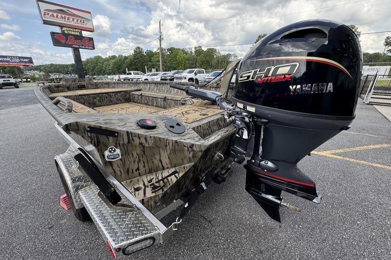 2026 Excel 183 Tomahawk boat with Yamaha SHO engine on a trailer in a parking lot.