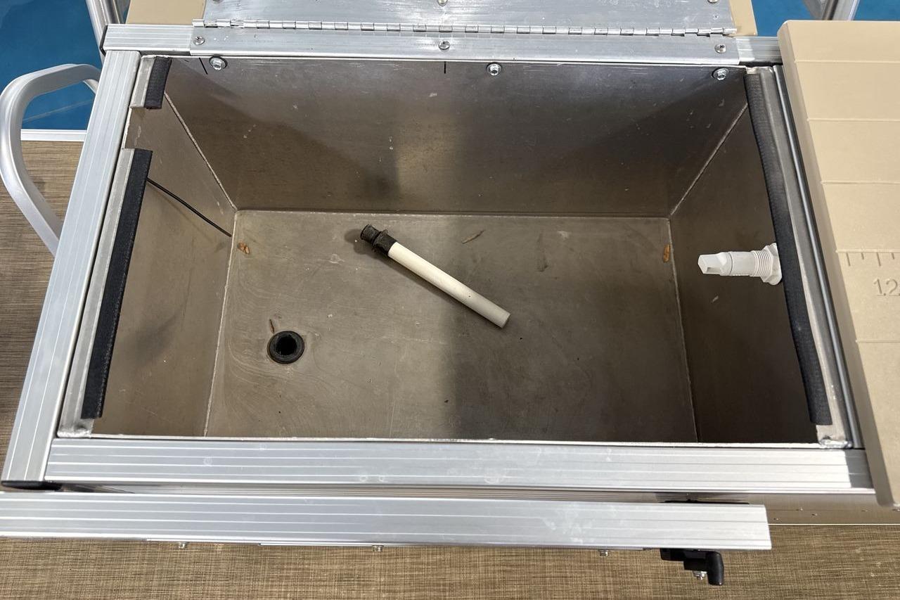 Open storage compartment in 2018 Landau Alure 212 Fish boat, featuring metal interior and fittings.