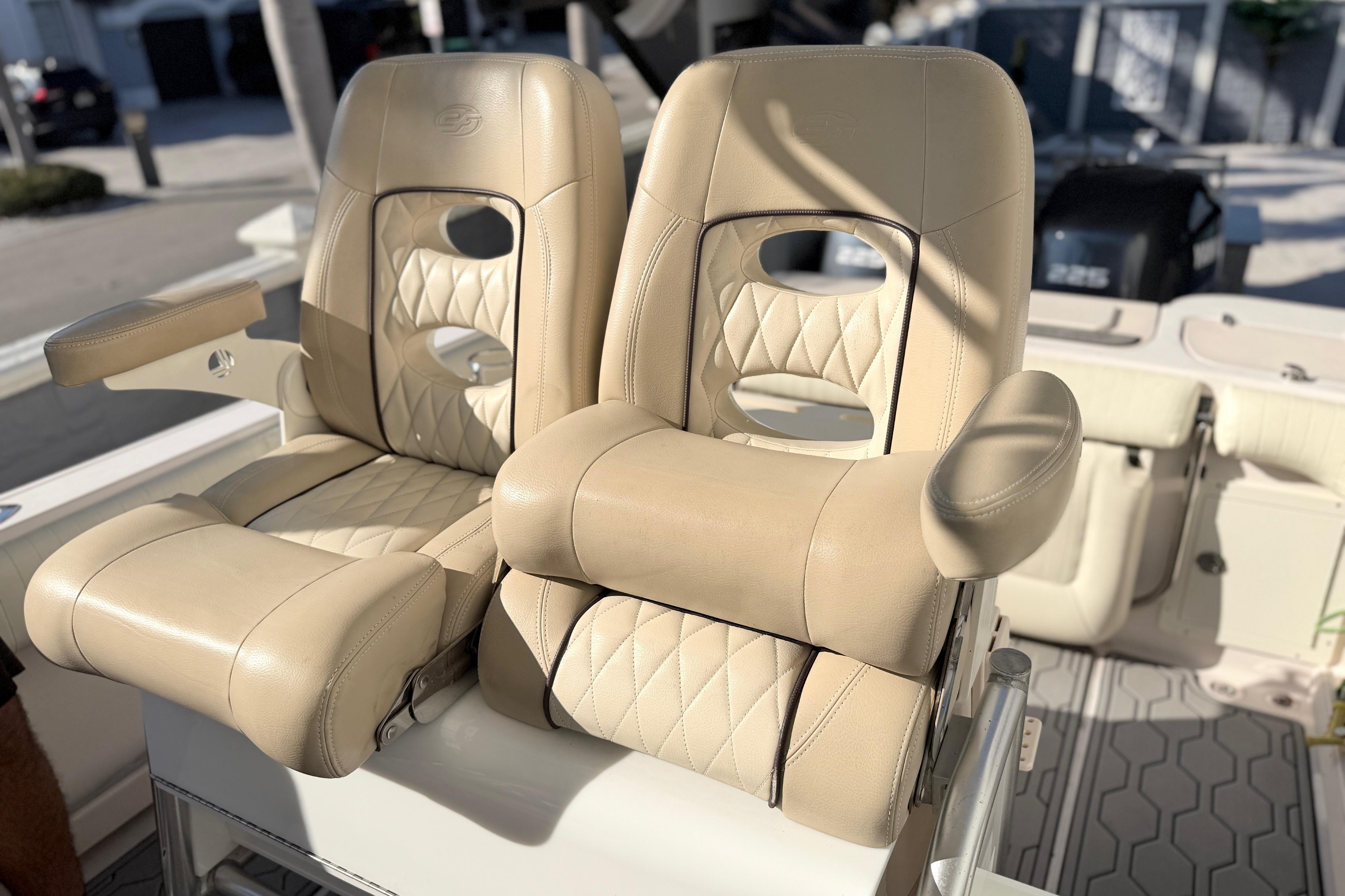 Luxury seating on 2004 Grady White 273 boat, featuring beige leather upholstery.