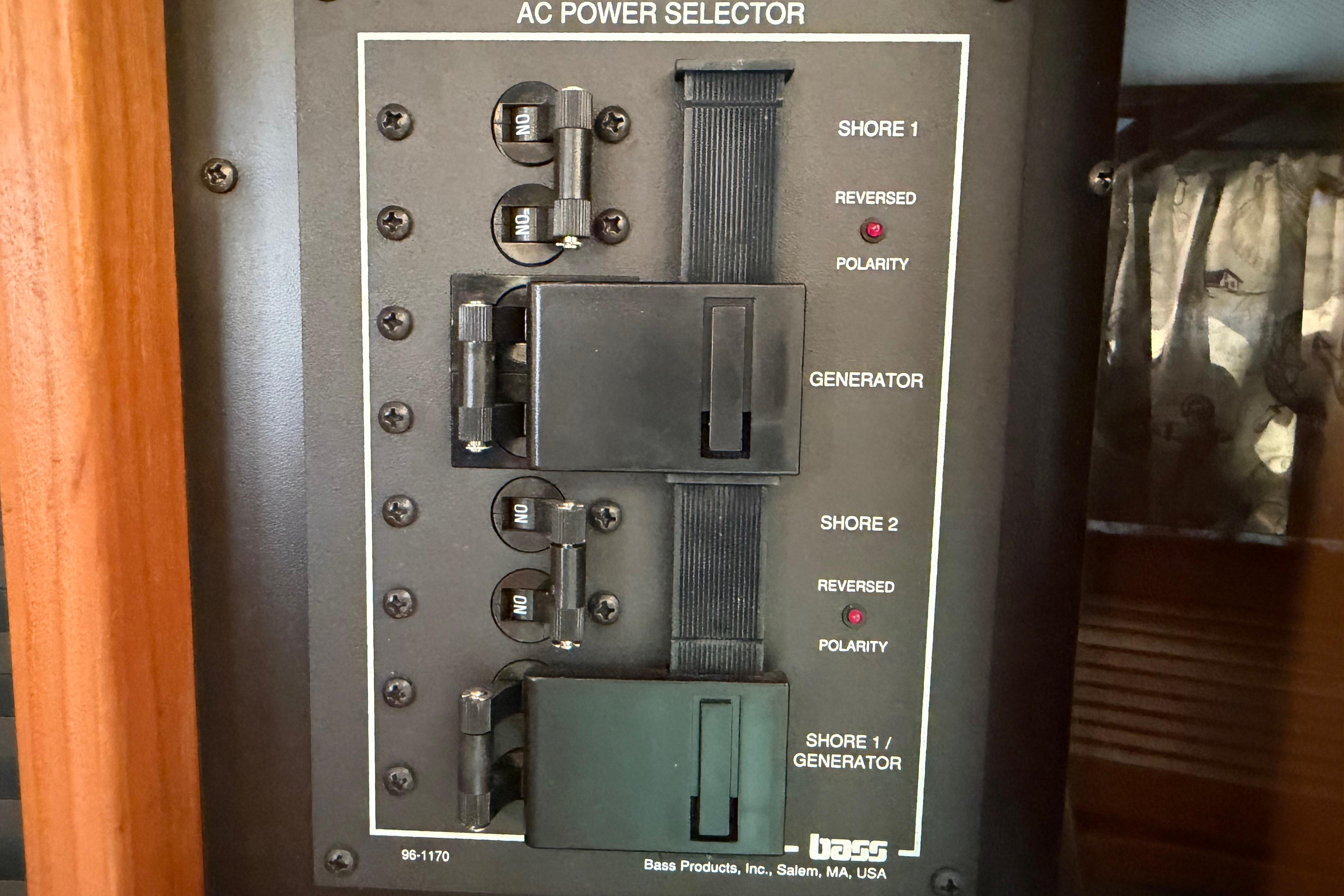 AC power selector panel on a 2000 Sabreline 36 Express boat.